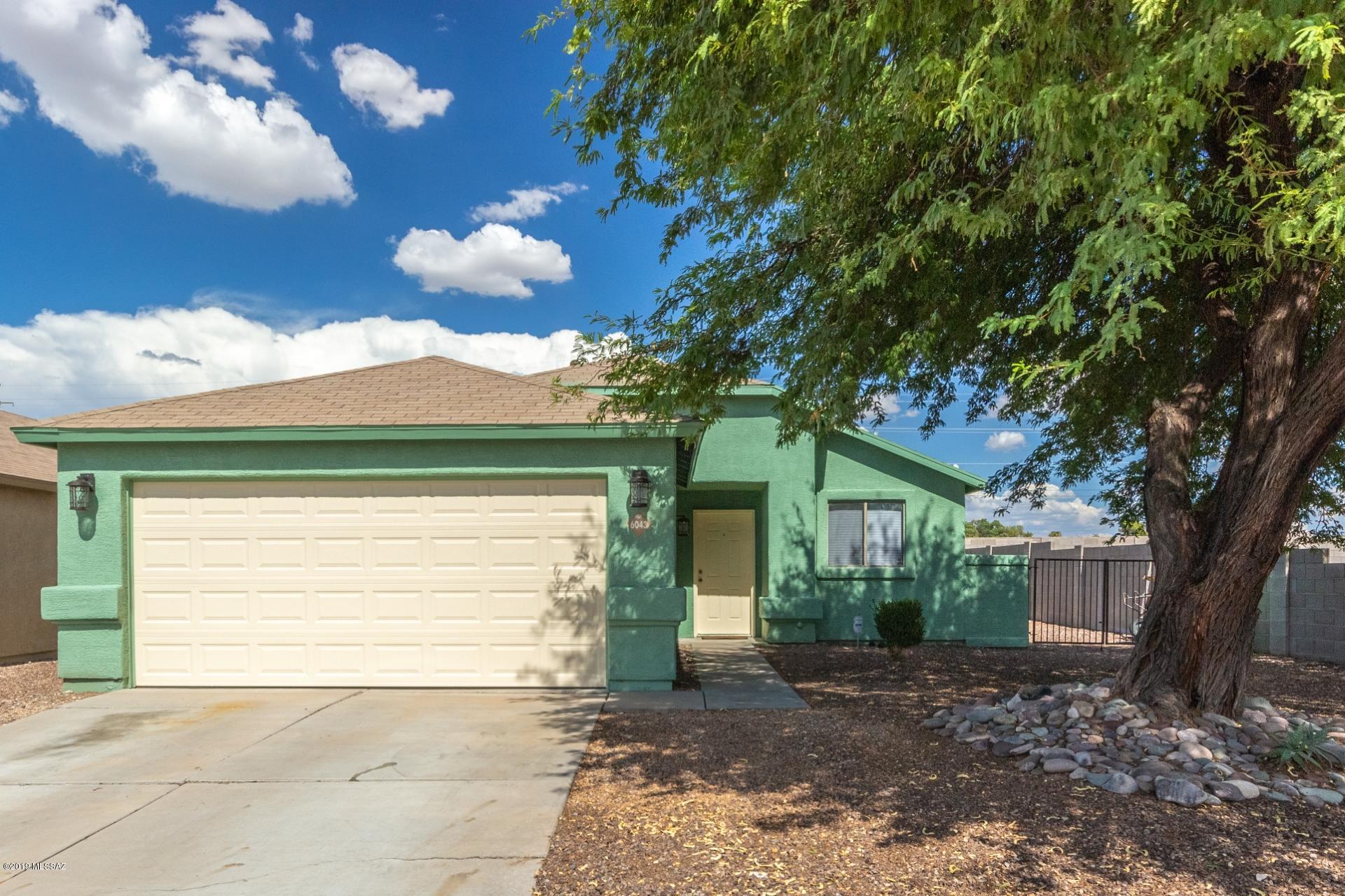 Fantastic 3 bedroom home available in a nice and quiet south Tucson neighborhood. Nestled just off of the I-10 and within easy reach of schools, parks, shopping and restaurants. Inside is open and bright. Spacious living area features vaulted ceilings and a warm color scheme. Pristine tile flooring can be found throughout all high traffic areas. No carpets for easy maintenance. Tasteful modern kitchen is complete with ss appliances and lots of stylish white cabinetry. Master retreat includes a walk-in closet, a private ensuite and sliding glass door leading out to the secluded backyard. Here you will find a covered patio, beautiful mountain views, and a built-in bbq, a perfect spot to enjoy Arizona outdoors. This home is move in ready and priced to sell. Call for your showing today.