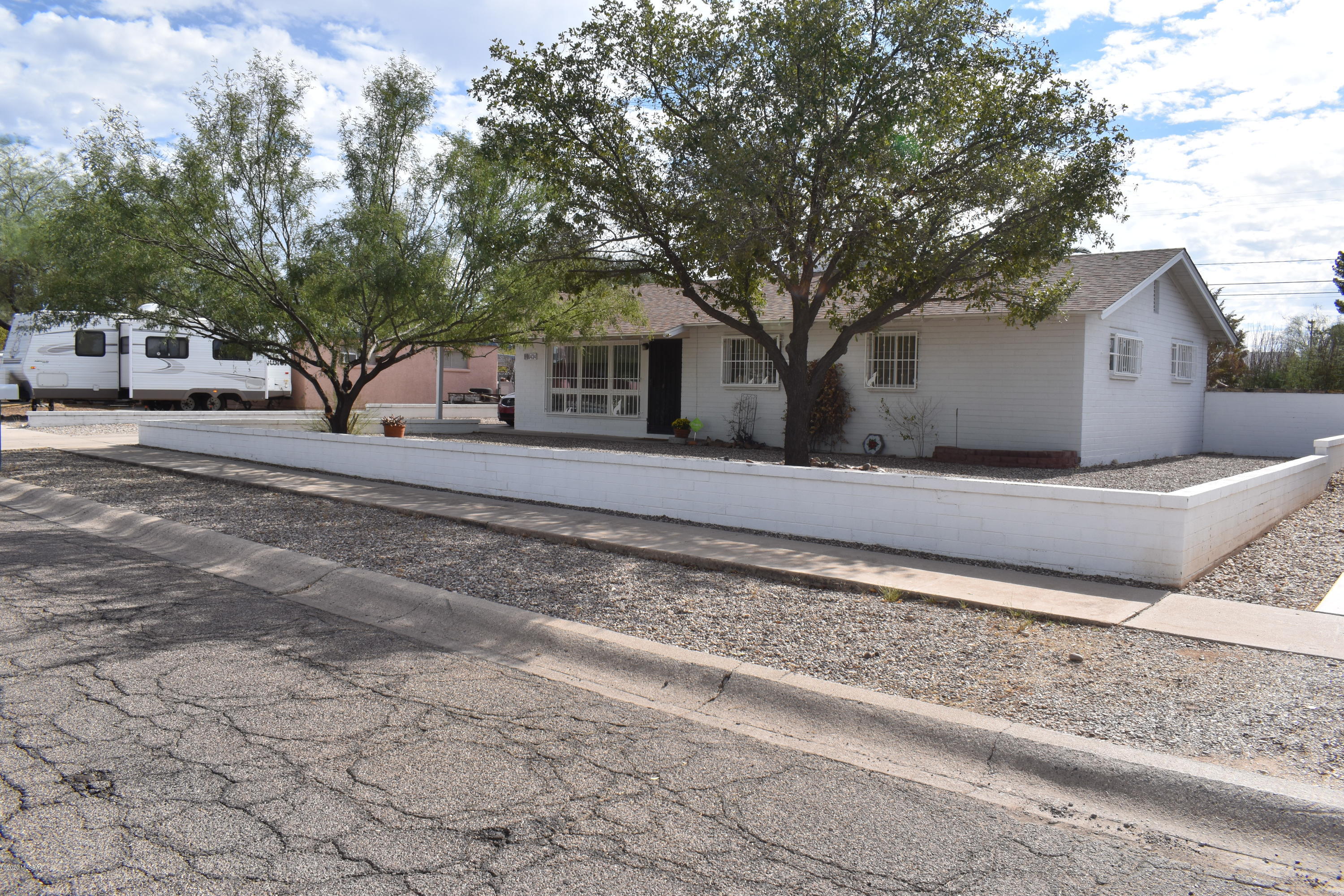Charming Eastside Home!  Landscaped front yard with 2 mature trees.   The huge picturesque window in the living room lets lots of natural light in!  Kitchen boasts gorgegous granite and stunning cabinets! Charming kitchen nook looks out on the backyard.   The hallway has 2 large cabinets for storage! Backyard oasis- has a huge patio great for entertaining.  The patio provides lots of shade as well as two ceiling fans for to keep your guests cool all day long!  The backyard also has a large storage room  & laundry room off the patio.  An additional HUGE workshop/storage is behind that!  Let's not forget the huge grassy backyard!  This home is where memories are made!