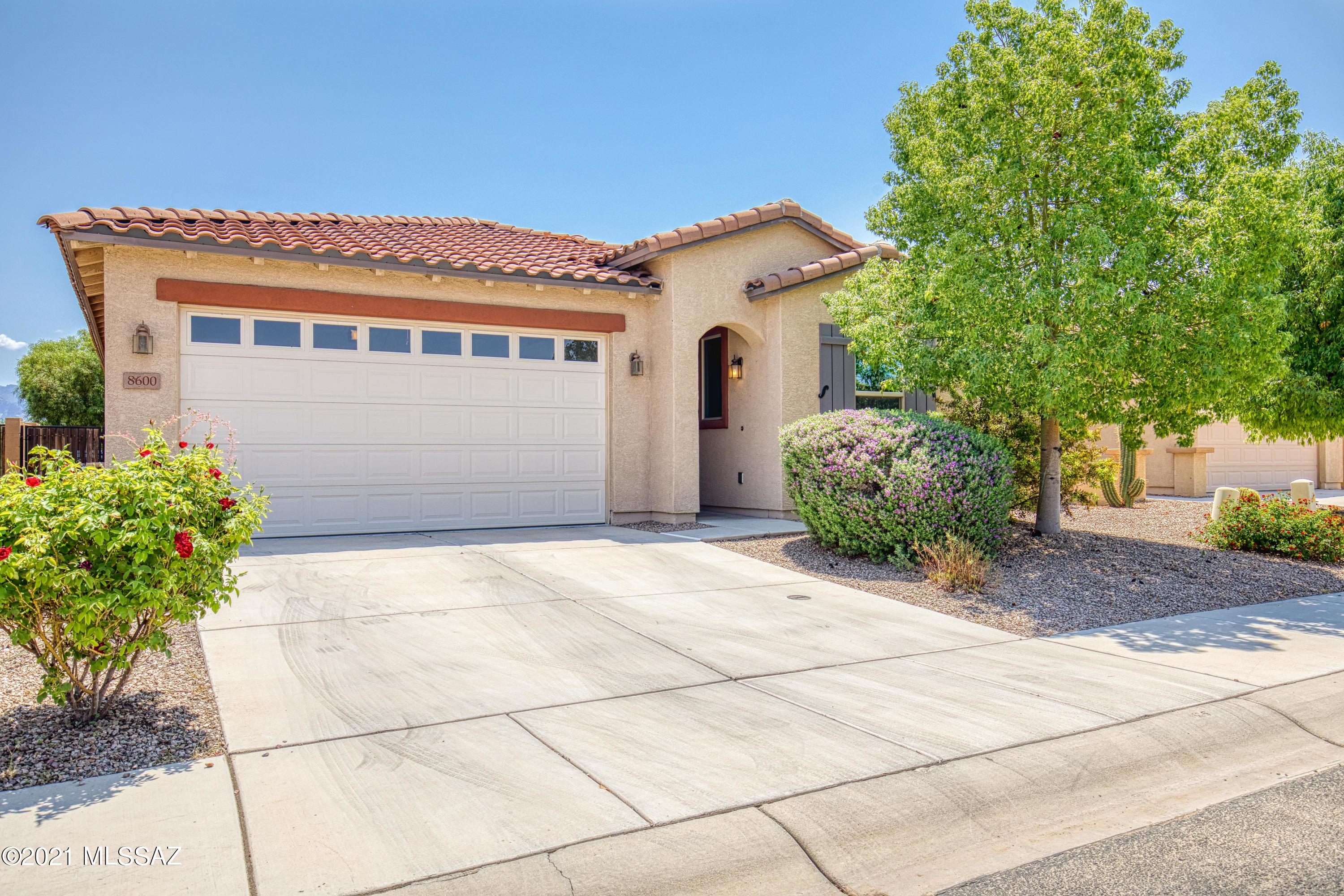 Immaculate home with breathtaking views of vibrant green fairway and majestic mountains.
