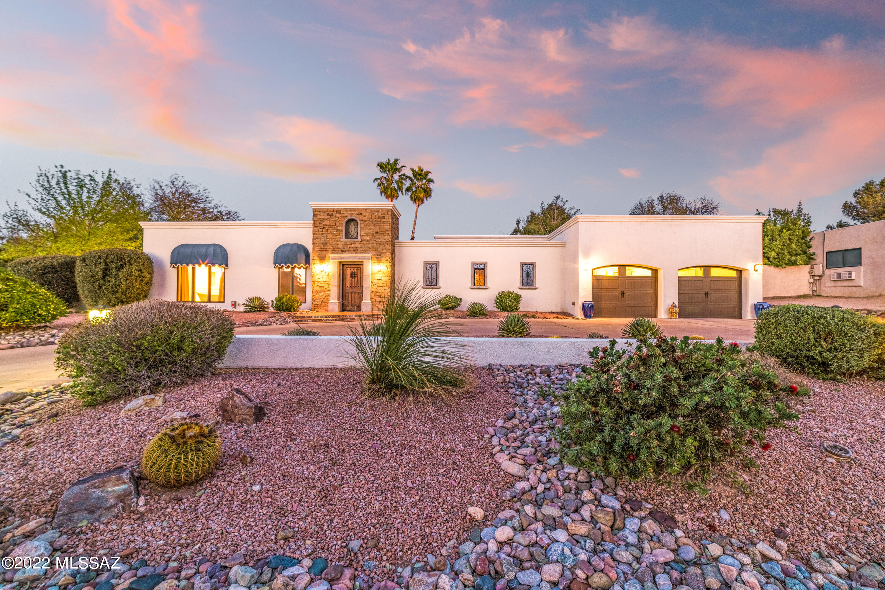 4 bedroom, 3.5 bathroom home located in the desirable Tucson Country Club Estates. Just a short distance from the clubhouse, offering golf, tennis, pool, dining and more. Private courtyard entrance with access to the 3 car garage. The front entry way leads you in to the bright and spacious Living Room with wood burning fireplace and windows looking over the backyard. Kitchen with double oven, gas range, island and walk-in pantry. Expansive Main Bedroom w/ office or sitting area, and Main Bathroom with dual vanity, shower, soaking tub, and walk-in closet. Sit back and enjoy a movie in the Media Room, which could be converted into an additional bedroom. Bonus Room with kitchenette could be playroom, studio apartment, or gym. Enclosed yard with pool, covered patio and outdoor fireplace.