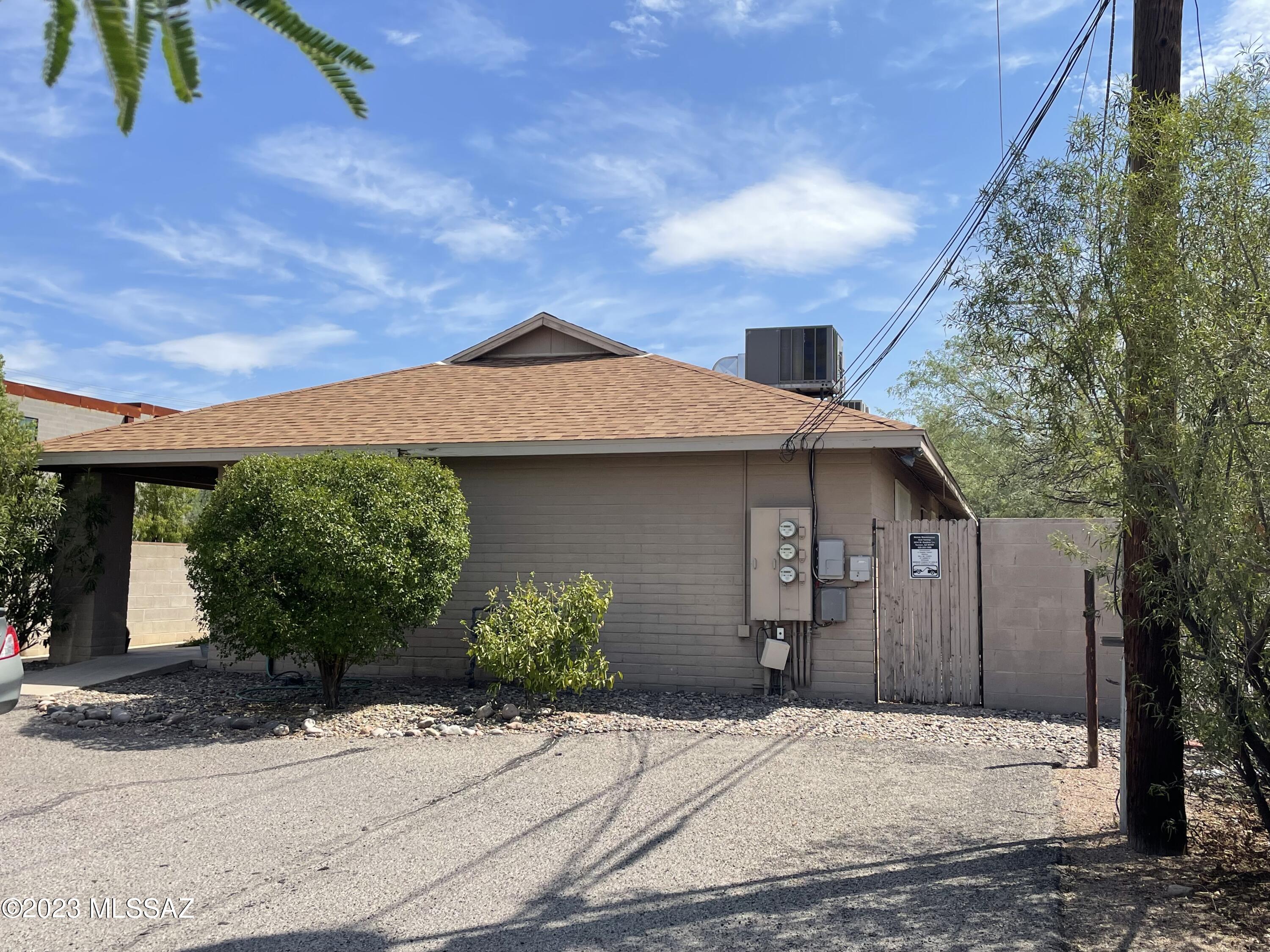 Location, location, location! Amazing opportunity to own this money-making tri-plex, separately metered and walking distance to the U of A. Fully occupied with leases in place until Summer of 2024 and rarely vacant with fast turn over time. Unit #1 is a 1 bedroom 1 bath that has been recently upgraded with tile and granite. Unit #2 is 2 bedrooms, 2 baths with tile in main living areas. Unit #3 is 4 bedrooms, 2 baths with upgraded laminate flooring and a large wrap around yard with a garden. Each unit has its own private patio separated by block wall. These are exceptionally well maintained. You won't be disappointed. All the units come with the existing appliances which includes the washers and dryers located inside each one. Tenants pay electric and gas. Owner pays water, sewer and trash