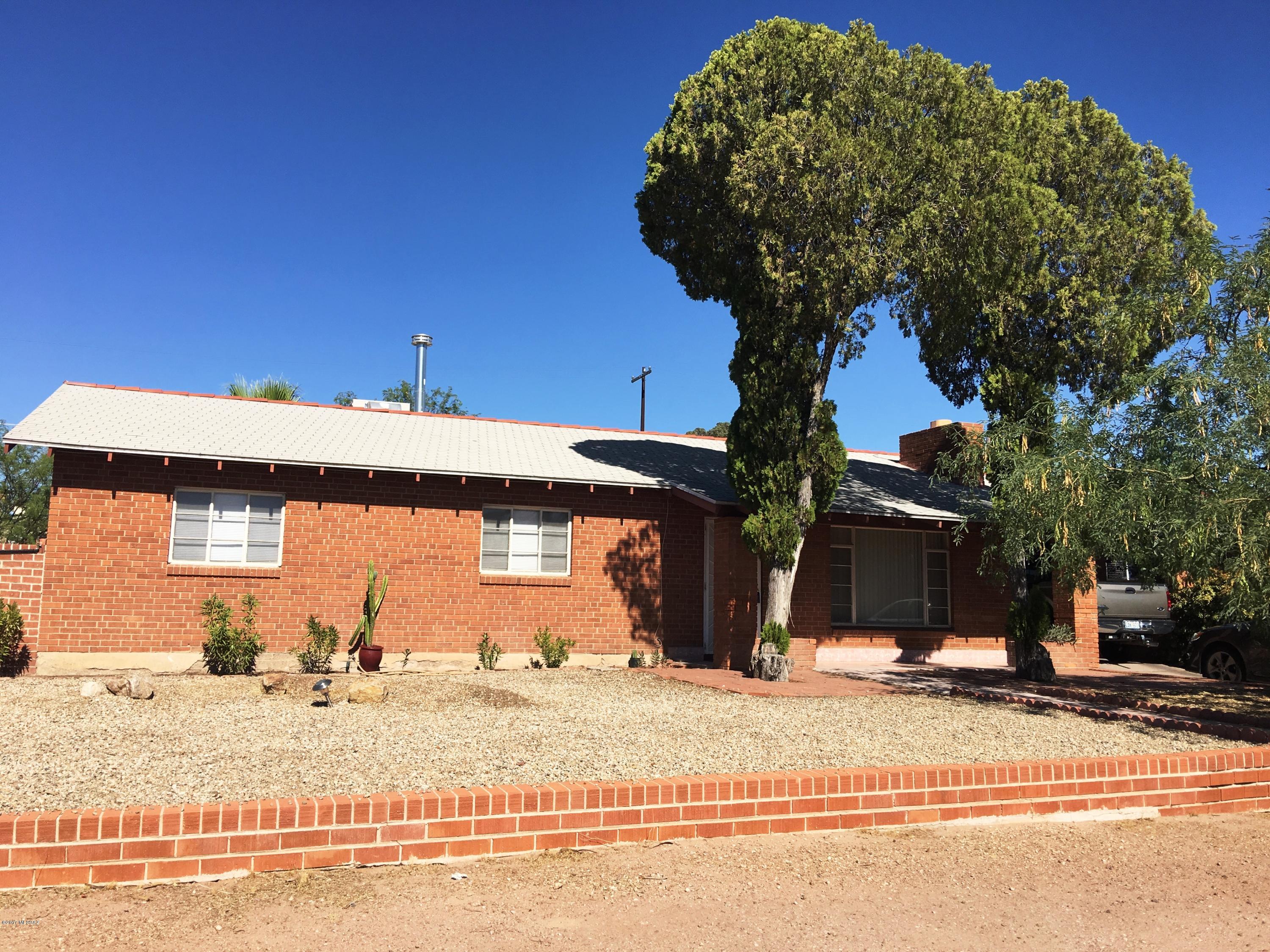 Great opportunity to for a classic Tucson home -- Brick built home in Broadmoor subdivision.  Located close to downtown, U of A and UMC.  Tile floors thru-out, extra large AZ room. Large east-facing backyard with block wall, and extra large Arizona room.