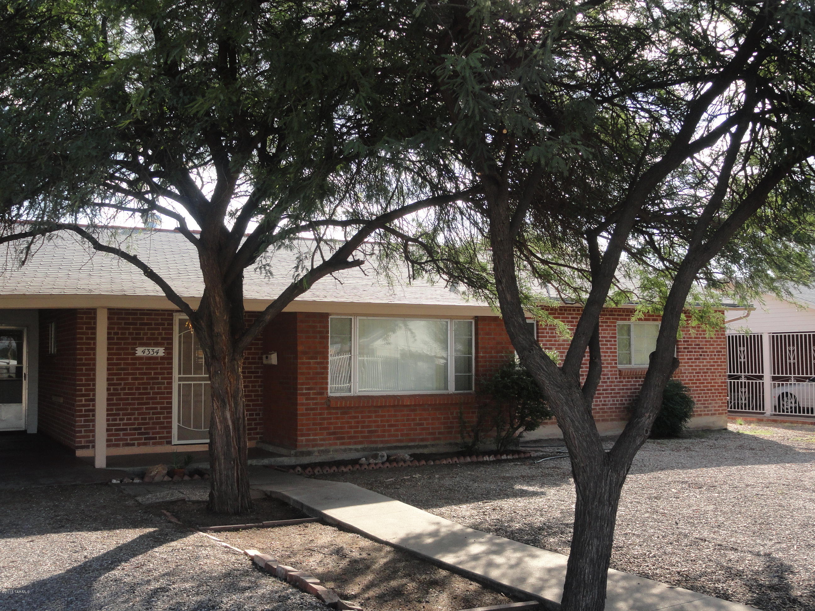 Charming Brick Home In Desirable Colonia Allegre! 
A den that can be easily converted into a third bedroom. Ample sized walled in yard, large workshop and/or storage room  w/water and electric.
Both heating unit and AC replaced approx.. 1.5 ago. Easy access and short distance to bus lines, movie theaters, shopping , banking and UofA. Walking distance to Reid Park. Seller offers Home Warranty !