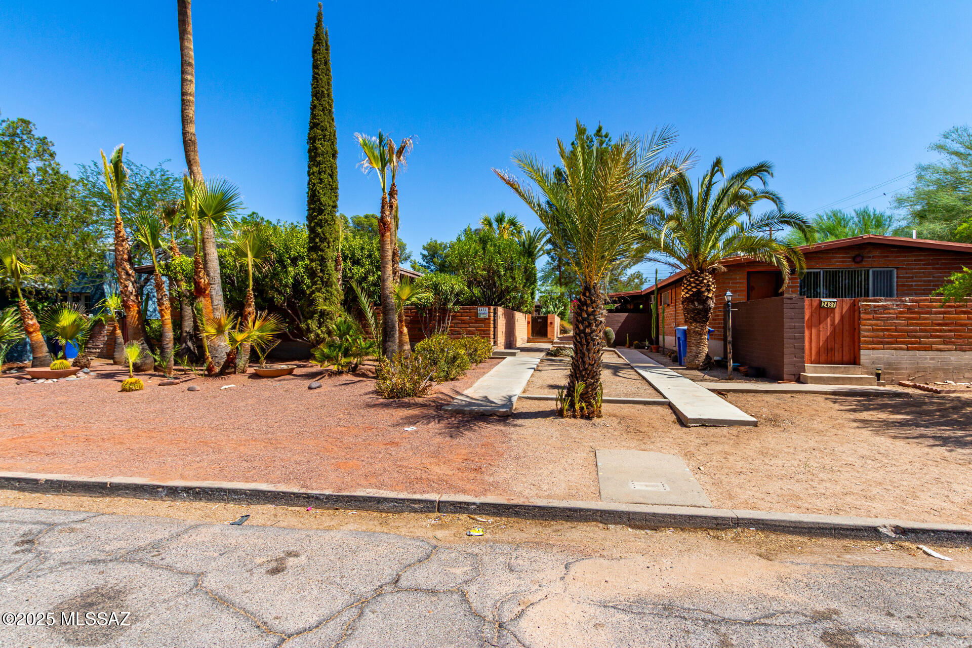 Rare opportunity to acquire a highly desirable income generating, multi unit property in the very sought after Sam Hughes neighborhood.  This charming Mid-century modern duplex is a short bike ride from the University of Arizona campus.  This fabulous investment opportunity would make a great addition to any real estate portfolio.  Both units are 2 bedroom, 1 bath and have separate electric meters.  Amenities include: covered parking, fenced yards, on site laundry facility and extra storage space