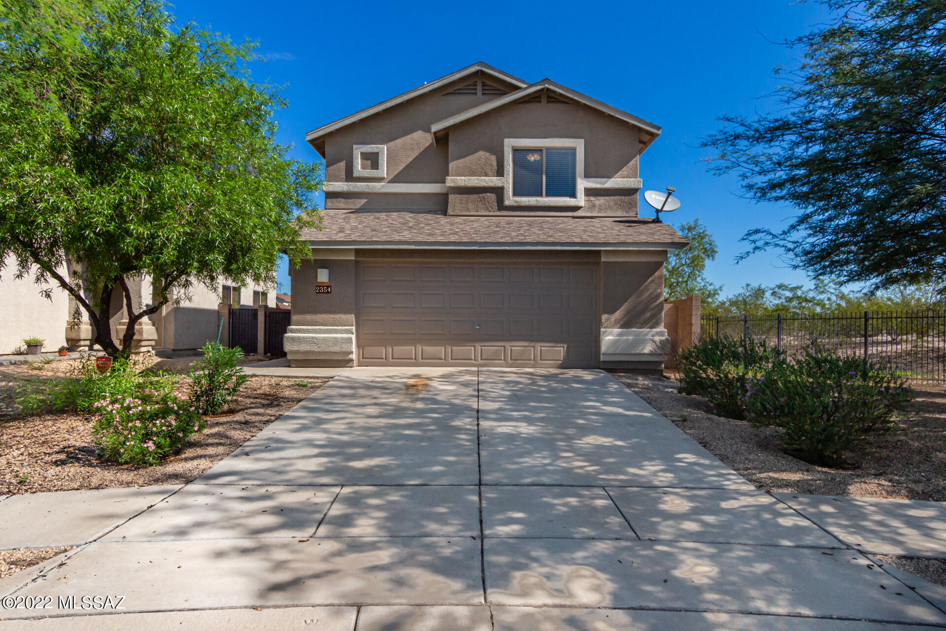 Pride of ownership is shown in this beautiful 3 bed, 3 bath residence in Rillito at la Cholla! Discover an impressive interior made bright & airy by glossy wood-look flooring, designer palette throughout, & dramatic high-vaulted ceilings. The spotless eat-in kitchen showcases plenty of wood cabinets, recessed lighting, a pantry, back patio access, & a peninsula with a breakfast bar. Relax after a long and busy day in the comfortable primary bedroom featuring soft carpet in all the right places, a private bathroom with dual sinks, & a walk-in closet. Enjoy mesmerizing mountain views all around from the lovely easy-care backyard with patio area! Don't miss out on this one!! Call to book a visit today!