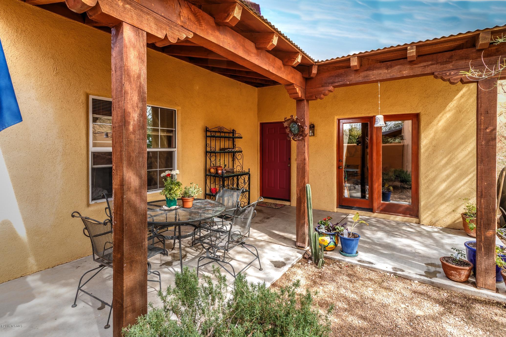 Range Priced: Seller to accept or counter offers between $215,000-225,000. RARE FIND in CIVANO! TJ Bednar former MODEL Home: upgrades such as custom tile counters & backsplashes; Saltillo tile in main areas; wood beam ceiling in Great Room; Beehive Fireplace; extended Patios; custom wall art; lush, oversized yard w/custom entryway; insulated garage w/extra outlets: the list goes on & on. This popular floor plan features TWO master Bedrooms; a delightful flow between inside/outside space & even has a private covered patio off ground floor master suite. GREAT CENTRAL LOCATION just a few steps to Tennis; South Pool; Coffee House; Tot Lot; Community Garden, Neighborhood Center & more. Be sure & check out all photos the call to see this great home TODAY!