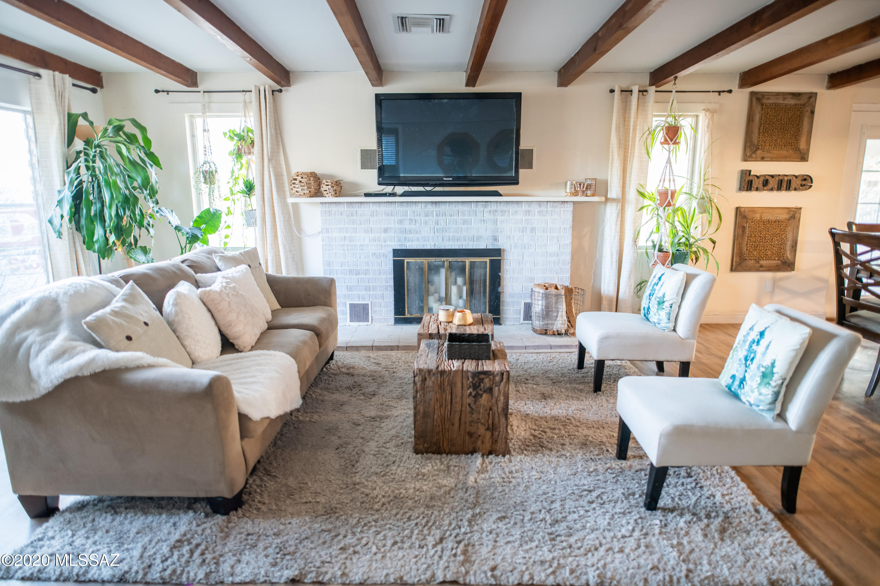 Sitting on 1.16 acres see this beautiful country charmer. The home features vast interior and exterior spaces ideal for multi-family, growing family unit and rental/VRBO opportunities. Enter into the living room with exposed beamed ceiling and an open concept ready for entertaining, 2 remodeled bathrooms, a great walk-in closet off the mst bedroom. Equip with a tankless water heater,  newer PEX plumbing, and upgraded electrical. This home reflects the Southwest with views, privacy and space to grow. Relax inside and out as the outside patio oversees the east side. Easy access to freeway, Tucson Airport and more. You'll love all the near by shopping, trails of A mountain, and more. Must SEE!!
