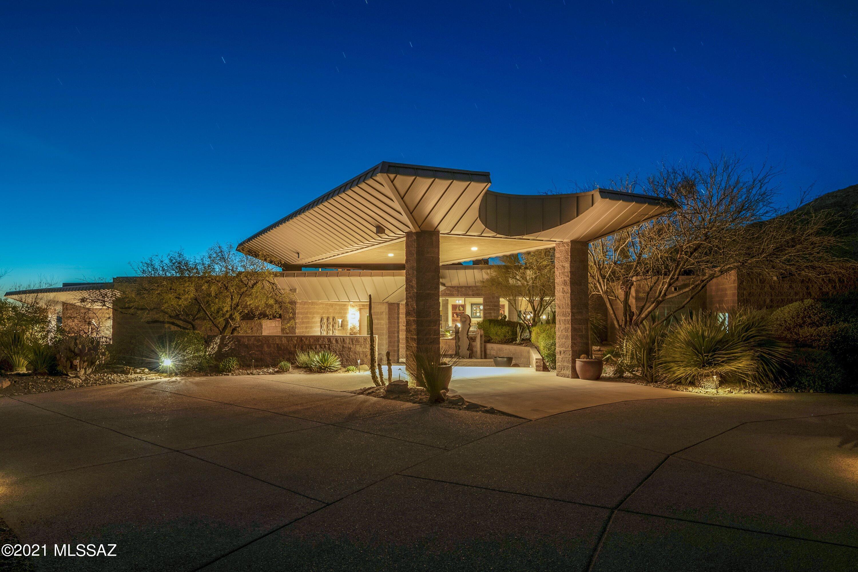 This architectural masterpiece designed by Evan Eglin and interior design by Lori Carrol, features some of the best views in Tucson. Located in one of Tucson's most exclusive communities of The Canyons. This home is tucked away on a  private 1.98 acre lot, with natural stone floors, open floor plan, separate guest casita, unparalleled city and mountain views w/complete privacy to entertain. A spacious floor plan with  Gourmet kitchen open to the dining and great room. Walls of windows capture the twinkling city lights and captivating desert that surrounds you in this exclusive foothills community.  Master suite features lavish city views, enormous walk-in closet, large ensuite.  Every room has a private bath.  Enjoy your own private gym and wine cellar. Call LA for a private tour.
