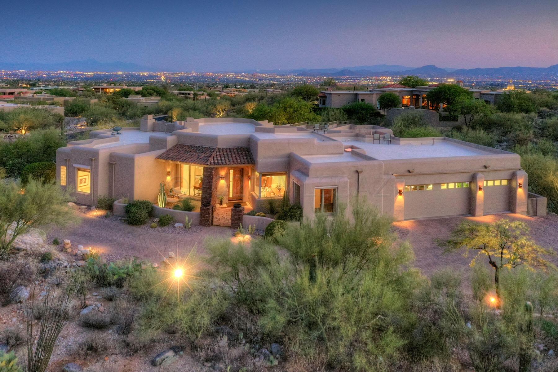 Stunning soft contemporary with city and mountain views in prestigious gated Pima Canyon. Front gated courtyard w/ sparking fountain, exquisite Greatroom with high ceilings, dramatic fireplace, walls of windows, gourmet island kitchen w/ alder cabinets, granite countertops, Wolf gas range, Sub Zero, pantry, lovely breakfast area, gorgeous travertine tile floors, Pella windows and doors, 3 bedrooms plus den w/ custom built-ins or 4 bedrooms, 3.5 baths, plus exercise room or office, large laundry room,  master w/sitting area, fireplace, Lux. bath w/ jacuzzi tub, natural stone countertops, 2 walk in closets, private entry to rear patio. Enjoy fabulous bkyd w/covered patio, pool, spa, waterfall, fireplace, wonderful trees, 3 car garage, brick paver driveway and views, views. Truly perfect!!