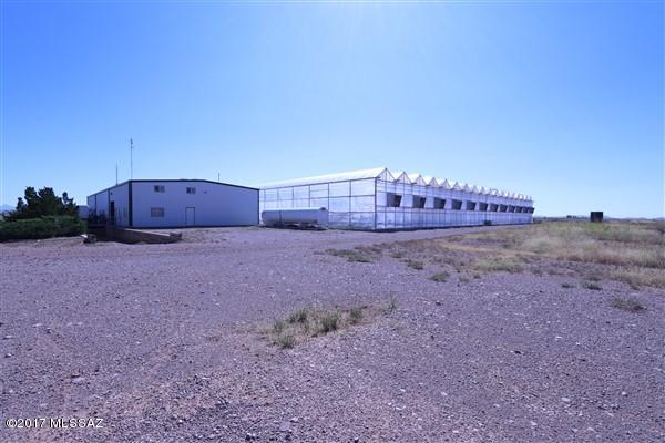 Certified Organic farm. 312.6 acres, 60,000 square foot commercial green house, 10,000 square foot commercial green house, 7250 square foot packing warehouse, pump house, and generator building.Triple wide affixed manufactured home, double wide manufactured home. Pellet mill, silos and loading dock. Built in 1996 operated continuously until the summer of 2017. Sale is of the real estate and improvements, not the business. This property is located near Willcox, AZ in Cochise County which is in the SE corner of Arizona. Tucson is approximately 80 miles north. Property is surrounded by mountains at an elevation of approximately 4300 ft MSL.