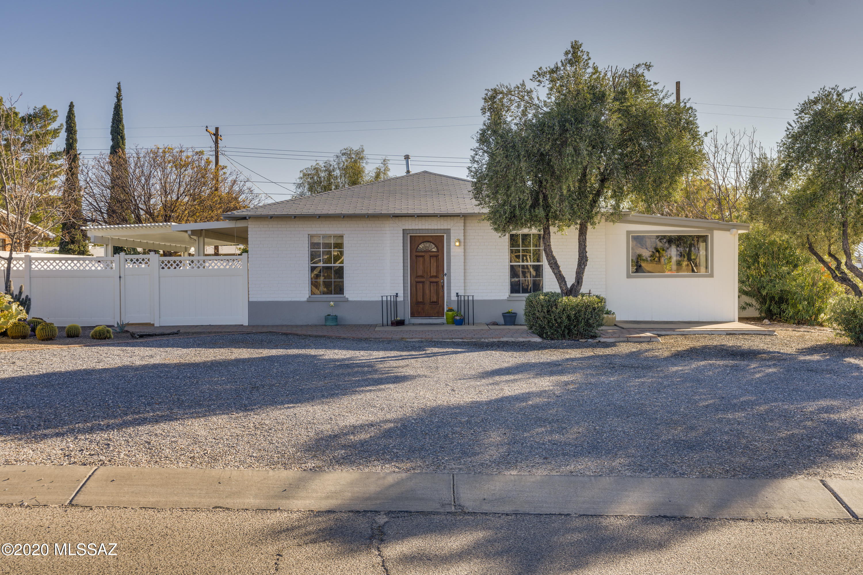One of a kind, beautiful white brick, 4BD/2BTH split floor plan.  Hard wood floors mid century.  Bright, open, with separate living and family rooms. Large corner lot.  Two patios.  Great location close to Palo Verde park;  walking path, basketball, tennis, dog park, playground, swimming pools, baseball and football fields, and ramadas.  Close to Park Place mall shopping, movies and  restaurants. Nicely updated over the years with AC, double pane windows, newer roof with attic space well insulated.  NO HOA.....