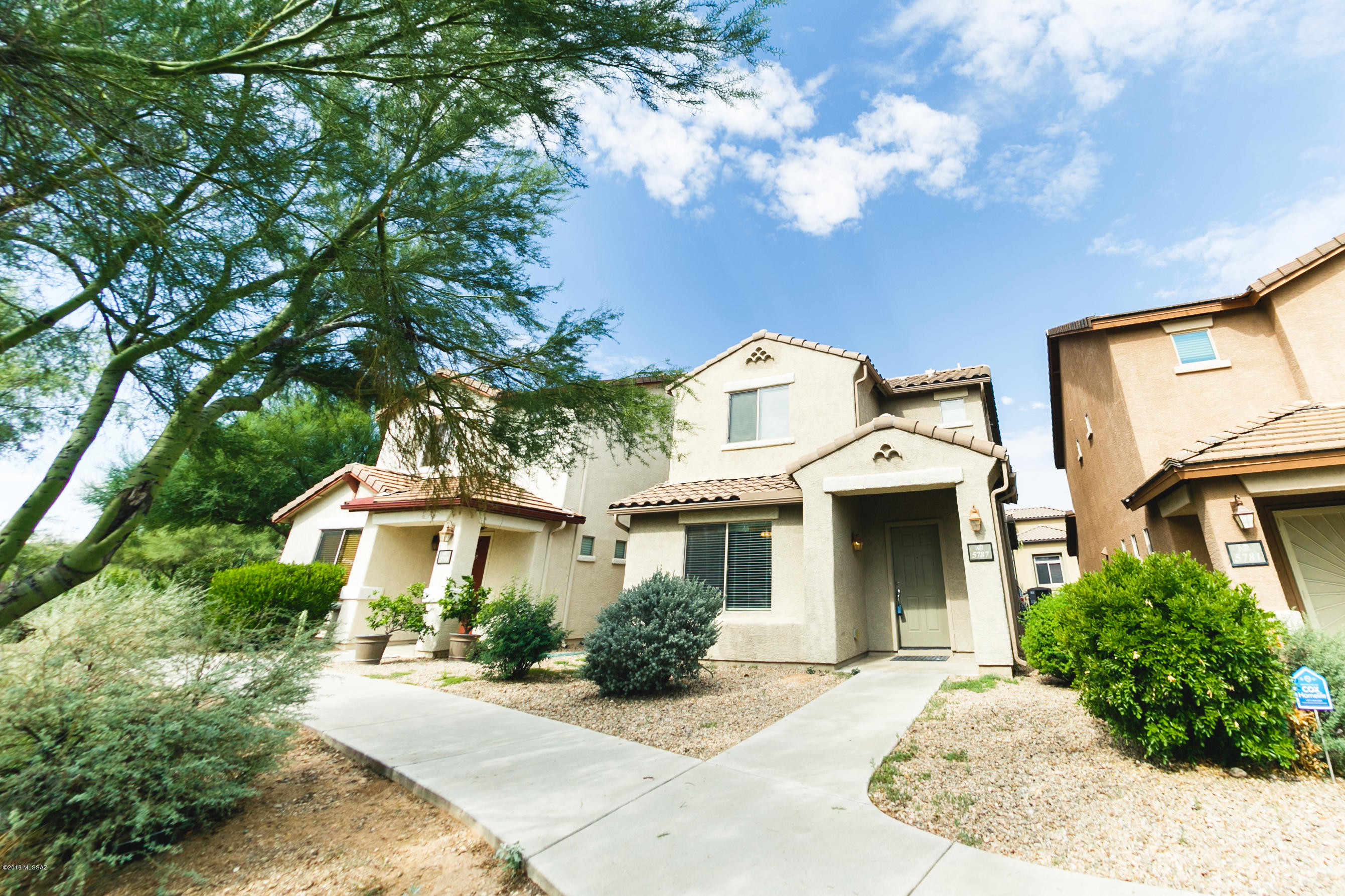 Here is your chance to get into the highly desirable Sierra Morado neighborhood and Vail School District!  This gorgeous 2 bed, 2.5 bath model home is within walking distance of the beach entry community pool, community center, multiple parks, and a bike/running path that weaves throughout the community.  The first floor opens into a large family room with the kitchen overlooking.   The master bedroom with ensuite bathroom and walk-in closet give you space to relax.  One more bedroom and a full size bath complete the second floor.  Front of home opens to a generously sized open space with breathtaking views of the Rincon Mountains!  This home won't last long, so place your offer today!