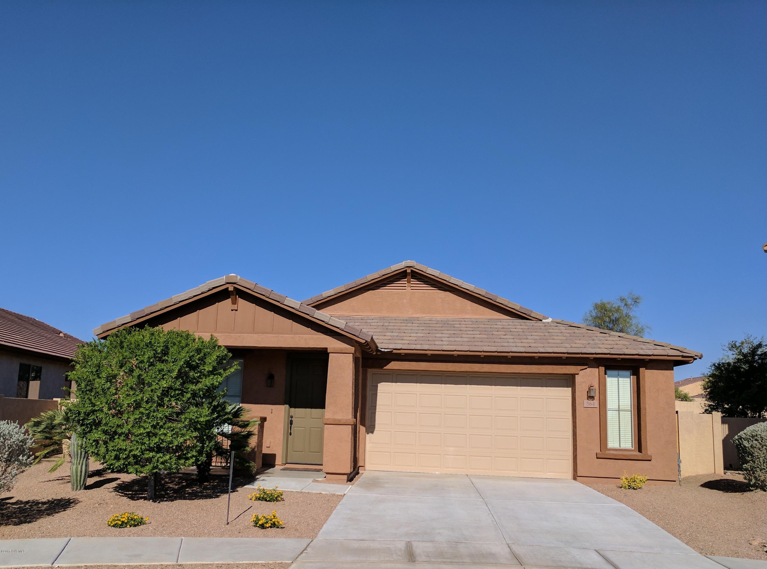 Absolutely beautiful Rancho Sahaurita home in the gated community of Entrada Bonita. Built in 2010 and so clean and well-kept, it looks BETTER than new! There are 2 living spaces, a gorgeous kitchen with 42 inch upper cabinets with pull knobs, black appliances, gas range, breakfast bar, and dining nook. Opens into a family room with custom built in storage and a desk. Master offers a separate garden tub and shower, large walk-in closet, and dual sink vanity. 2.5 car garage with a 5 panel door. House is situated on a large lot, with an RV gate, tall back fencing, and no rear neighbors. The back yard is hardscaped with pavers, there's a roll down shade on the covered patio, and the side yard has a garden area and storage shed. Walking distance to the award winning Anza Trail K-8 school.