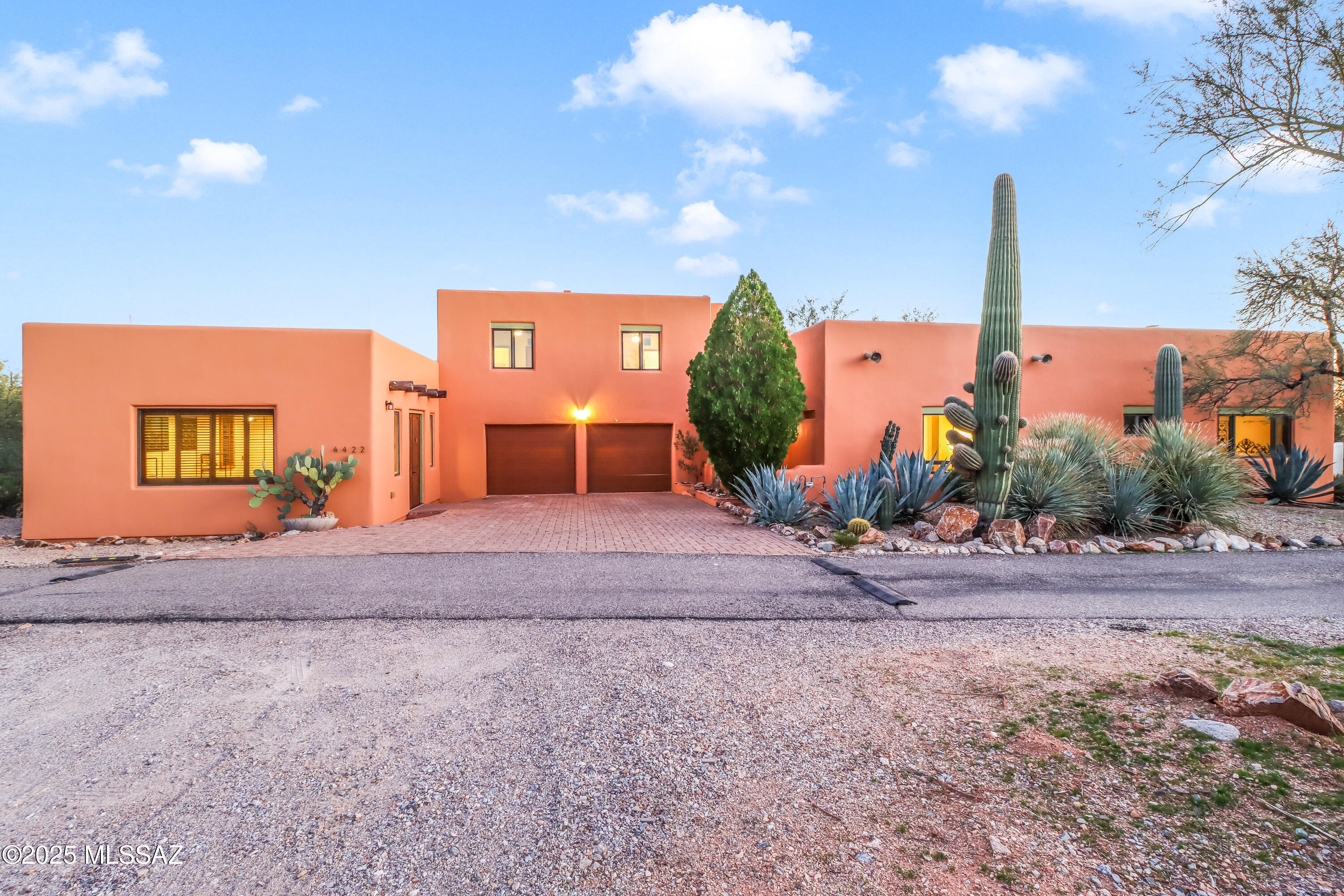 Range price $799,000-$850,000. Welcome to Casa Del Charro—an amazing multifunctioning estate in the Catalina Foothills surrounded by Tucson's charming desert landscape with premium amenities nearby. This Southwestern property features a main living space on the ground floor with 2 bedrooms, each with its own bathroom and access to the outdoors. There is a formal living room with a built in library wall, great Catalina views, and an adjacent powder room. The family room is open to the dining area, and features a fireplace and access to the back patio. The warm kitchen comes equipped with a commercial size stainless steel range and gorgeous tile work. Upstairs, there are 2 additional bedrooms, each with a half bathroom. The upstairs bedrooms share access to a fully-tiled spanish style shower room. These rooms can be closed off from the rest of the house, as there is a separating door that can be locked, and a separate entrace from outside of the home. This could be a great income generator. On the other side of the large garage is a heated and cooled addition that can be an office, workshop, den, or guesthouse conversion. Step out into the beautiful covered patio, leading out into the pool and gardening area. Come. See. Stay!