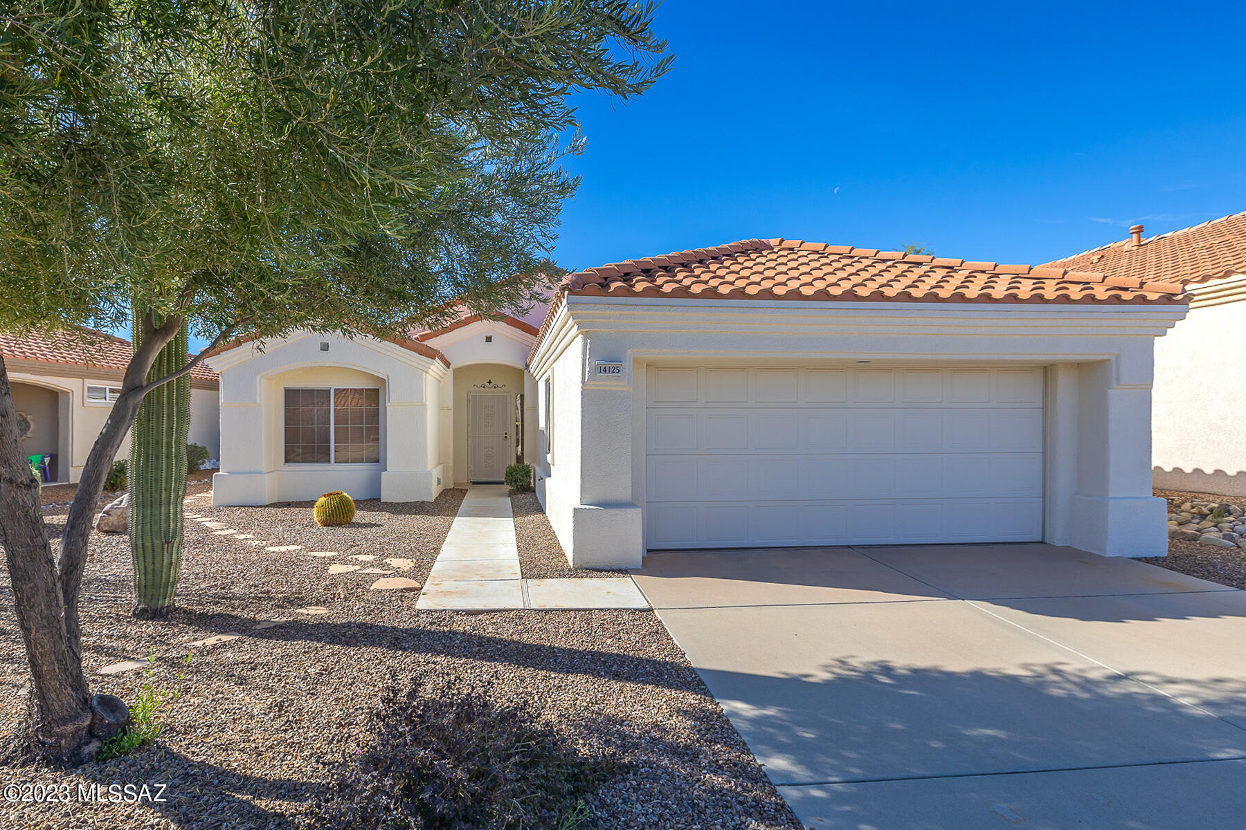 Charming 2BD/2BA (1190 Sq Ft) home in desirable Sun City. Added Bonus- Arizona Room!! Great Room features built in media area and abundance of natural light.  Chef's kitchen showcases stainless steel appliances, dining area and Arizona Room access. Lot's of Windows that allow that Arizona Sunshine In. Spacious Owner's Suite boasts walk-in shower and closet with Arizona room access. Split floor plan allows for private guest room and bath.  Sizable Backyard with peeks of Catalina Mountains. New HVAC in 2019 and Roof 2018. Sun City Active Adult Community Features clubhouse, fitness center, golf, pool, library and more!!