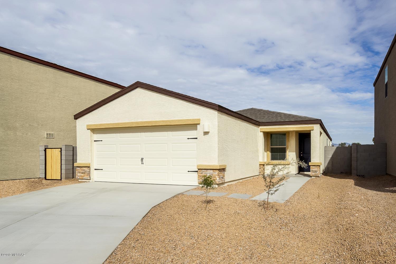 The beautiful Ironwood plan is located within the picturesque community of Cantera. This new one-story home features an open floor plan, 3 bedrooms and 2 full baths, complete with thousands of dollars in upgrades. Upgraded features include energy-efficient kitchen appliances, granite countertops, designer wood cabinets, brushed nickel hardware and an attached two-car garage. The Ironwood showcases a luxurious master suite complete with a walk-in closet, as well as a fully fenced backyard, and front yard landscaping. In addition, Cantera provides residents with easy access to the best of Tucson.