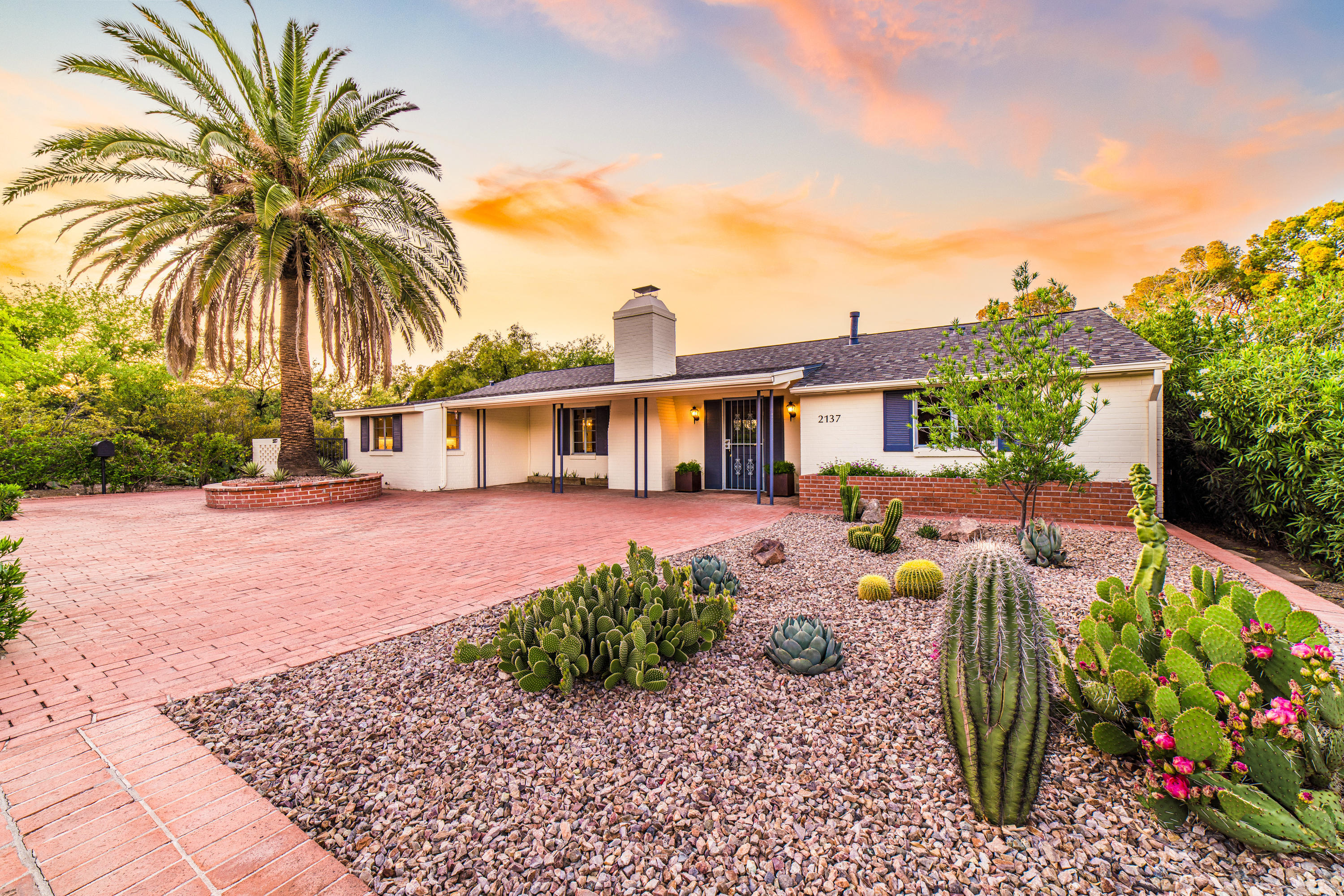 STUNNING, historic home, with Guesthouse located near the prestigious & iconic Arizona Inn, Banner Hospital & UofA. This 1948 Ranch style home has been lovingly updated with great care taken to maintain the charm & historic designation. Spacious Greatroom w/Fireplace, built-ins & floor to ceiling glass and patio doors to the outdoor living. Light & open kitchen, dining & hall bath completely remodeled in keeping with era. Master suite features one of the finest dressing rooms w/built-in closets & drawers leading to the completely renovated master bath & laundry closet. Br#2 w/ large closet, BR#3 features built -ins & corner desk. Lush backyard w/privacy, covered/uncovered living, 1 BR Guesthouse w/laundry room & storage, 3 Car Garage. See update list under Document link