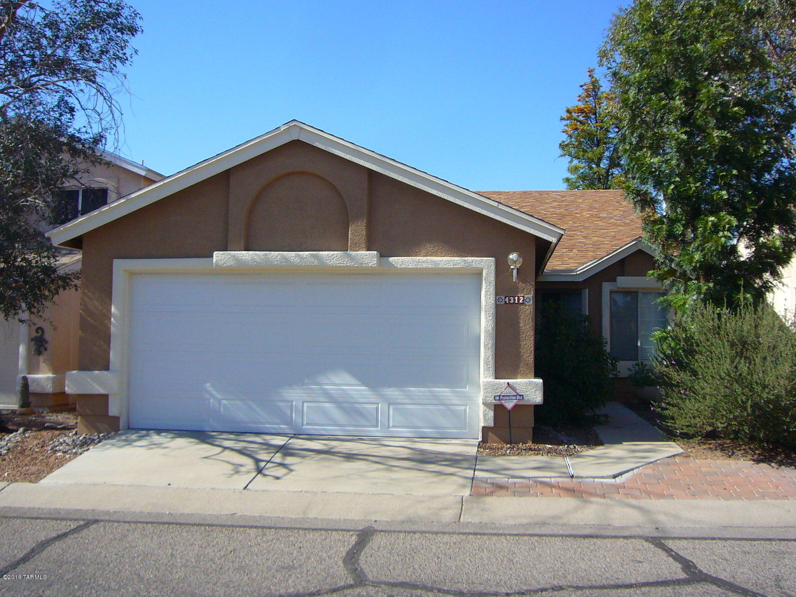 Adorable 3 bed 2 bath home in great NW location with community pool. Tile flooring throughout (no carpet). Vaulted ceilings. Large eat-in kitchen with black appliances including side-by-side refrigerator, glass top electric range, microwave, & dishwasher. Master bath has large garden tub and master bedroom has glass slider to the back yard. Covered patio leads to private back yard with mature trees. 2 car garage. Community pool and spa close by. Non-smoking home. 1 year minimum lease. R/O system is as-is with no warranties. Call for additional lease details.