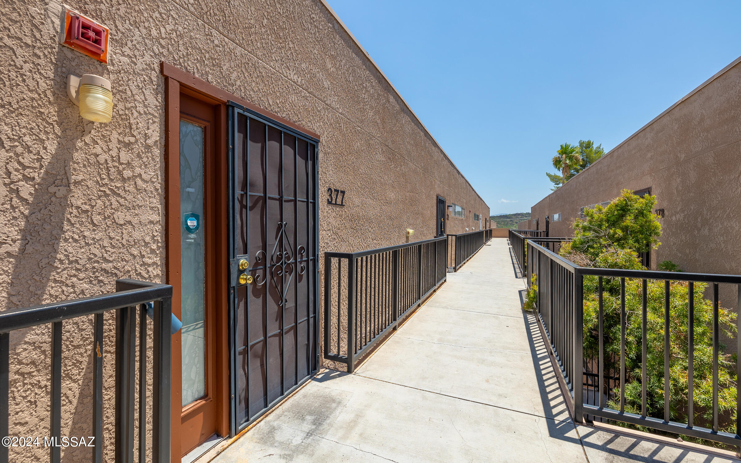 This 1 bedroom/1 bath/1 level condo w/covered parking has had all the heavy lifting done: New HVAC in 2021, doors and patio floor freshly painted; popcorn was removed & unit received a full interior paint; new carpet & laminate installed throughout the home; A new fridge in 2023, microwave in 2019; bathtub was resealed, new light fixture and medicine cabinet in bathroom; new ceiling fans in 2020; security screen door installed for improved look & safety in 2019; The home has a wonderful open floor plan with plenty of natural light coming through clerestory windows and a gorgeous balcony walk-out. The space feels cozy w/a fireplace & its many improvements. The bedroom is large w/double closets and new blinds. WATCH VIDEO!!