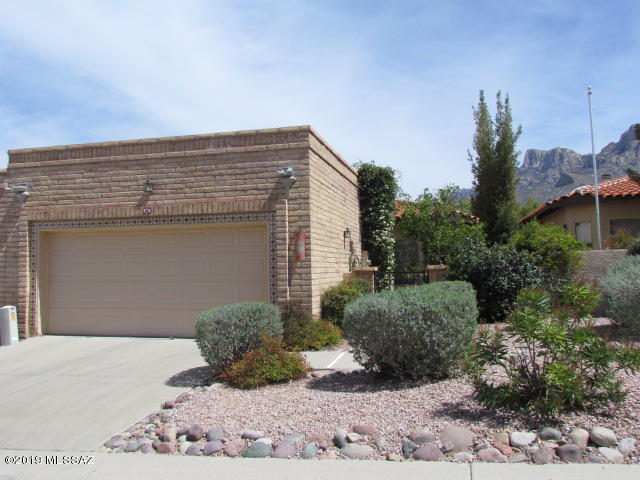 Incredible Oro Valley value. Highly sought after Valle Del Oro Community. Rare find, 2 spacious bedrooms and 2 bathrooms, over 1500 sq ft, split plan with soaring vaulted ceilings, offers a discreet elegance,  spacious bright and open floor plan. Large kitchen with bay windows around sunny breakfast area.   Perfect for year round living or winter residence. Peace and tranquility are found in this lovingly maintained town home.  True feeling of comfort.  2 car garage with lots of built in storage. Short walk to stunning community pool and spa area. Located in the heart of the Oro Valley, extremely convenient location to everything. This is a must see. Call for your private viewing.