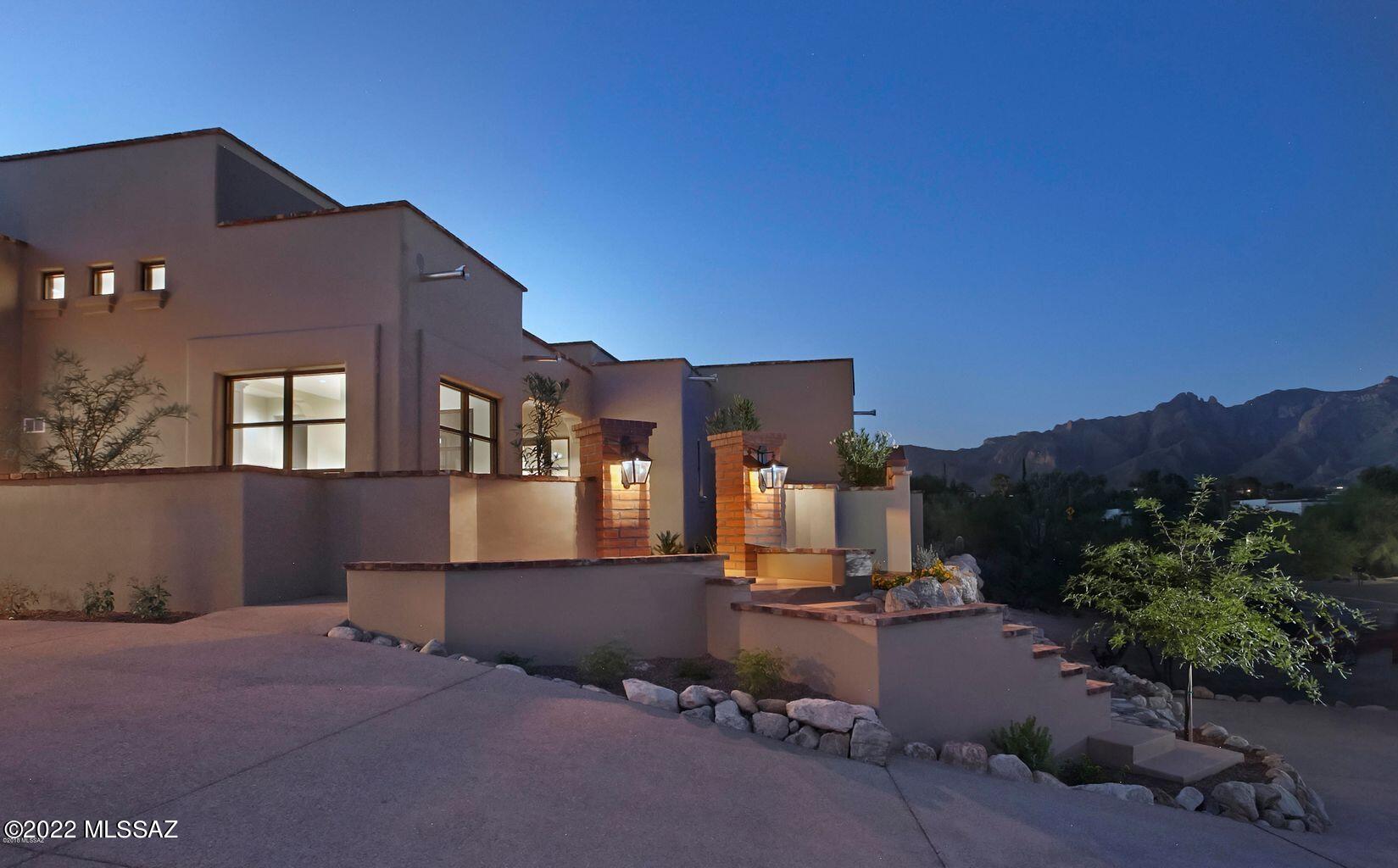Newer, 2016 Built, Spanish Contemporary in the Heart of The Catalina Foothills.  This Timeless 3 Bedroom & 4 Bathroom Home Sits on Over an Acre, Offering Privacy, and Spectacular Mountain Views.  Some of the Fine Features Include Charming Courtyard Entry, Custom Glass Front Door & Windows, Polished Concrete Floors, Solid Wood 8ft Interior Doors, 2 Fireplaces (Great Room & Master Suite),  Gourmet Kitchen w/Stainless GE Monogram Appliances, Imported Hand Painted Tiles, & a Retractable Door System Opening up to the Back Outdoor Living Space w/ Pool & Elevated View Terrace.   Oversized 3 Car Garage.  Ideal Location Close to All The Desired Foothills Amenities as well as The UofA & Downtown Tucson.