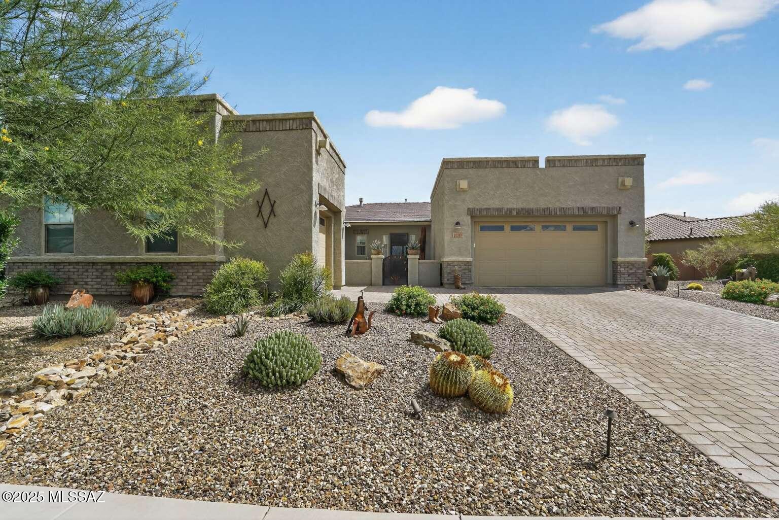 Stunning home at the base of Catalina Mountain. 3 bedroom 3 full bath and office/flex room. 3 car garages with 4ft extension with epoxy flooring and cabinets for storage. Upgraded 2 tone cabinets with extension into dining room. Cabinets complete with soft close drawers and cabinet. Staggered stone gas fireplace. Professional landscaping with awesome views of Catalina mountains. This lot had a lot premium shared by few. East west exposure sun sets in front. Back patio has a sunscreen porch for outdoor living. Backyard was plumbed for gas. This house is a must upgrades.