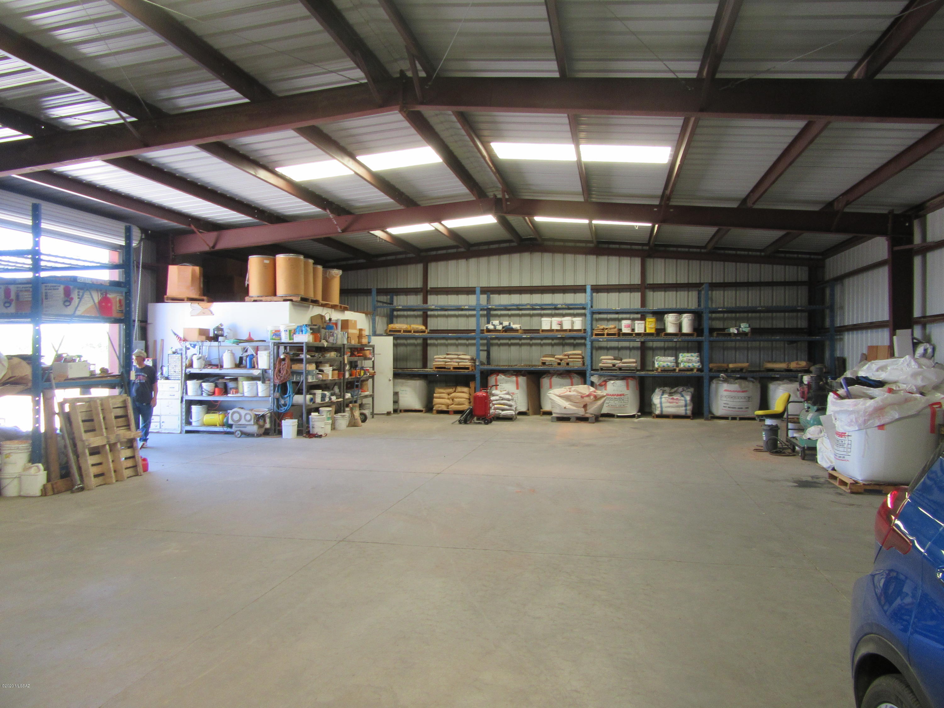 Excellent Owner user property! A nice clean property!  Never used as Junk yard land!.4,000 Square foot metal  warehouse building with grade level roll up 12' X 12' door on 2.82 acres .  There is a 2/3 interest in coop well situated on east property next door with physical access from subject property.  Small office area with 3/4 bath in the northwest corner of building.  Formally used as a clean sand yard.  Several other structures on property.  One mobile home for watchman.