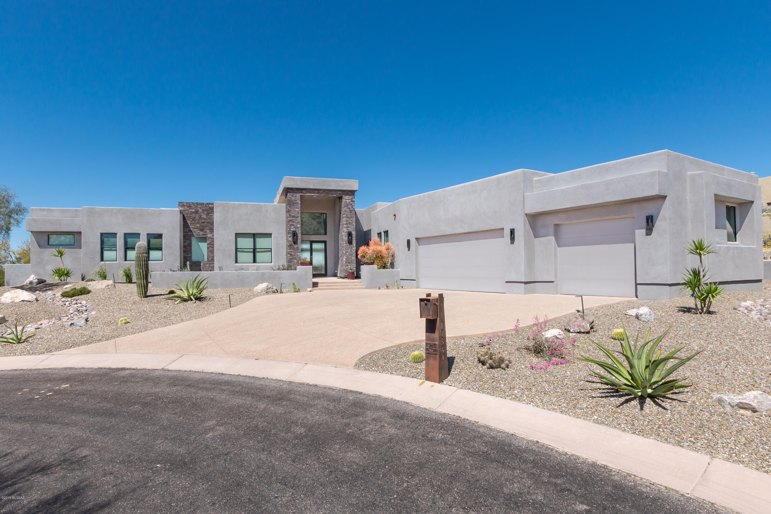 This is an Incredible Meticulously Designed Contemporary home in gated Solana at Dove Mountain.  Situated on the 13th fairway of the Gallery North Golf Course on a private setting in a cul-de-sac lot.
Breathtaking Panoramic Views of Sunsets, Golf Course and the Tortolita Mountains.  Grand Entry leads to Spectacular Great Room which shows off the Open and Flowing Floor plan of this Modern Living Design. Amenities include 4 Bedrooms, 3 and half baths and 3 car extended garage  with storage room. A TRUE OPEN MASTERPIECE DESIGN !