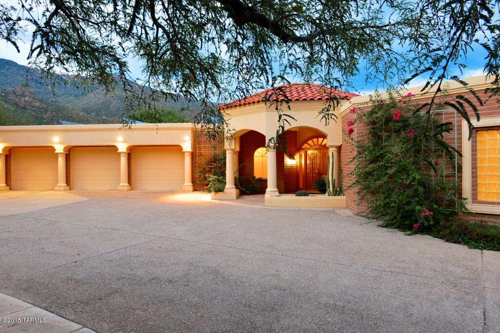Stunning home in desirable Alta Vista.  Well appointed on lot with city views to the South and mountain views to the North.  Entertain with lights twinkling at you from wall to ceiling window in dining room.  Private patio off master enjoys these same enchanting views.  Spectacular pool, spa and deep wrap around patio with outdoor dining.  Windows in every room offer views of city or mountains.  Remodeled kitchen with granite, ss appliances, gas for cooking & abundant counter and cabinets.  High end stone floors, updated bathrooms.  Great architecture unfolds as you walk through this home. You will constantly be surprised by how great the layout and finishes are. PV solar included, salt water pool and expanded 3 car garage.