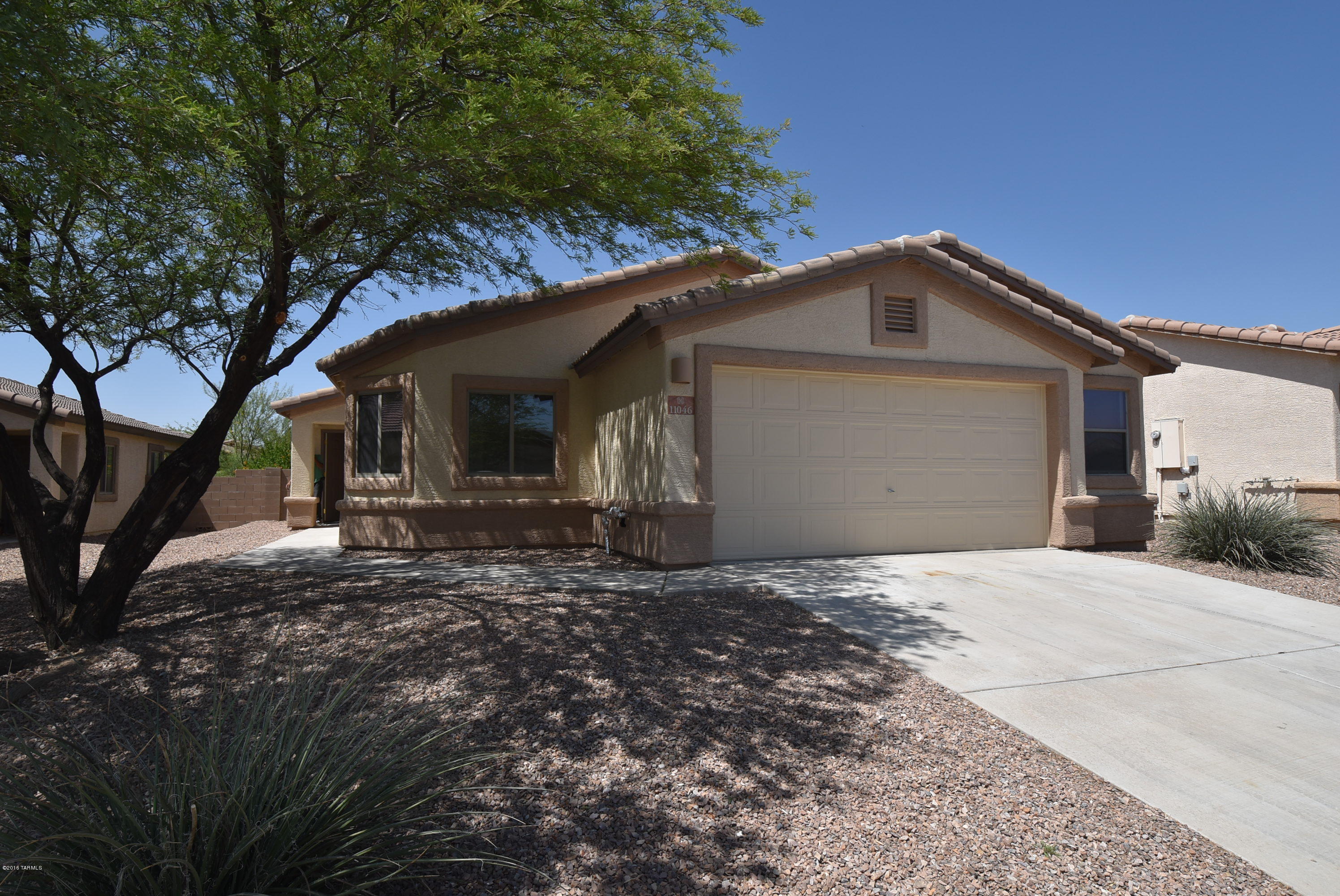 Beautiful Gladden Farms home in Marana. Popular great room plan with 4 BR, 2 BA, 2.5 car garage. Tile flooring in kitchen, dining area, laundry & baths. 2'' wood blinds throughout. Split bedroom plan with master bedroom away from guest bedrooms. 4th bedroom has a double door entry off the great room - could be used as a den/office. Master bedroom has large walk-in closet. Wide 2.5 car garage provides extra space for storage. Large yard with covered patio. Enjoy all that Gladden Farms has to offer including walking paths and a neighborhood park located just a few houses down the street. 1 year minimum lease. Non smoking home. $45 application fee per adult. Subject to credit approval. Renters insurance required.