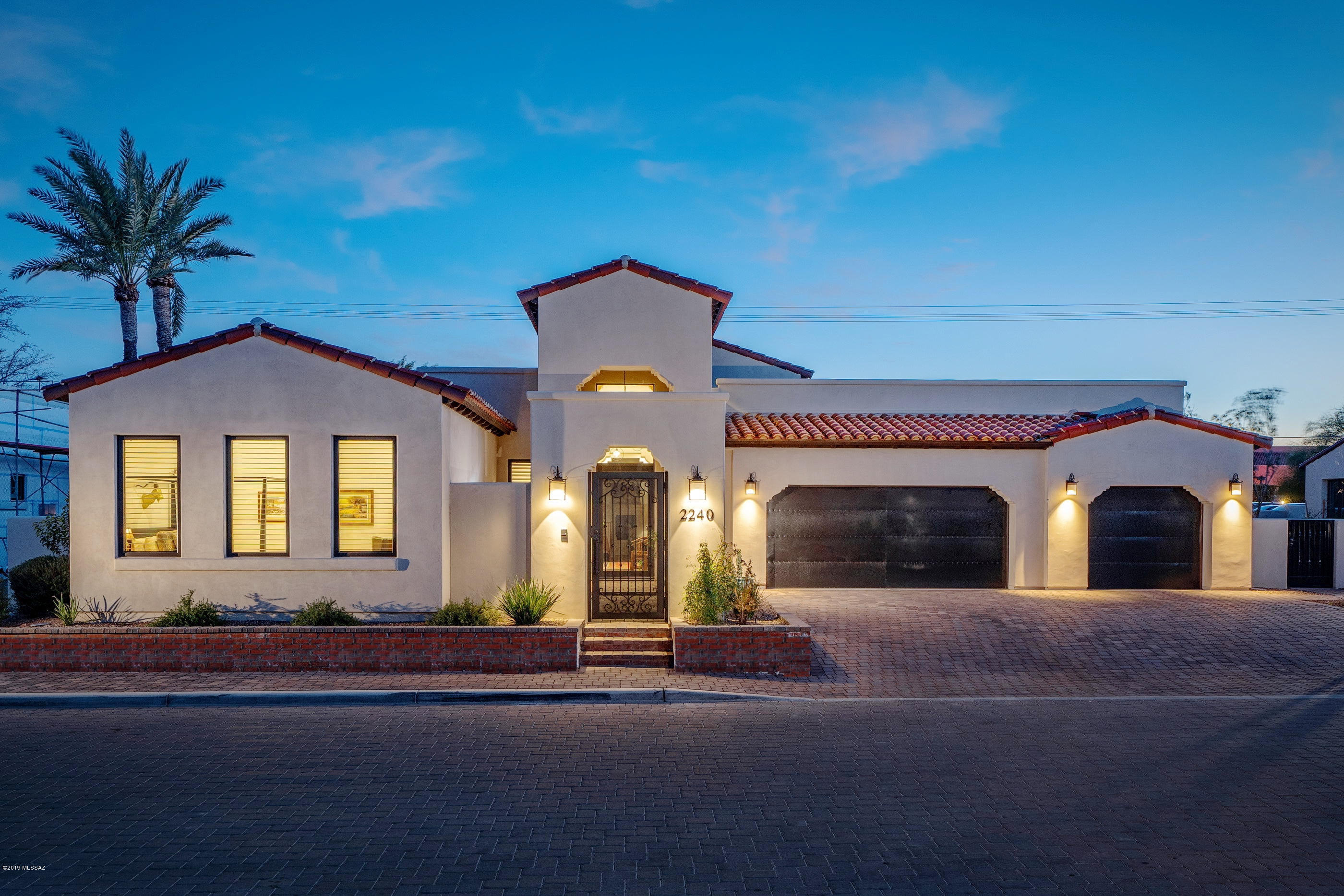 This stunning and dramatic, newly completed (2018) Santa Barbara fashioned custom, offers a modern open layout and seamless connectivity between individual living spaces. Located within steps of the famed Arizona Inn (National Register of Historic Places), this exquisitely designed residence is a showpiece of architectural prowess and sophistication. Enter through your private courtyard into the beautifully appointed interiors. Soaring ceilings, opening onto the generous living and dining areas, overlooking the gorgeous chef's kitchen, complete with top end Monogram pro series appliances, large center island, stunning Quartz countertops, breakfast bar and pantry.