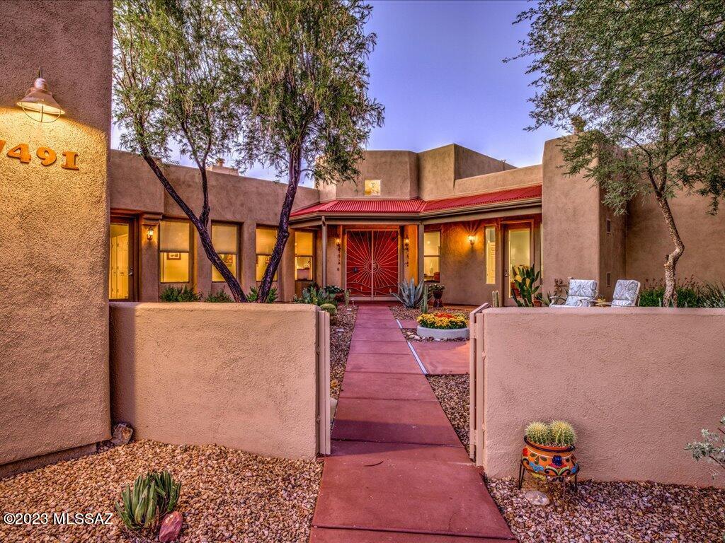 Enjoy unobstructed views of Saguaro National Park and the Rincon Valley, plus amazing privacy! Built on the most desirable view lot in the development with high ceilings throughout, a beautiful round entry foyer, tile floors, an open kitchen with granite counters. Solar system and all this in 2675 sq. ft. Host a sunset party on the oversized patio with new friends from the neighborhood. Walk to the year round heated pool and spa, new gym, tennis, low impact exercise, demonstration kitchen, art exhibits. The Arizona Senior Academy is the cultural hub of the community with events, concerts, and programs for lifetime learning. The resale homes in Academy Village have the best views by far and don't overlook rooftops, so don't miss seeing this house!