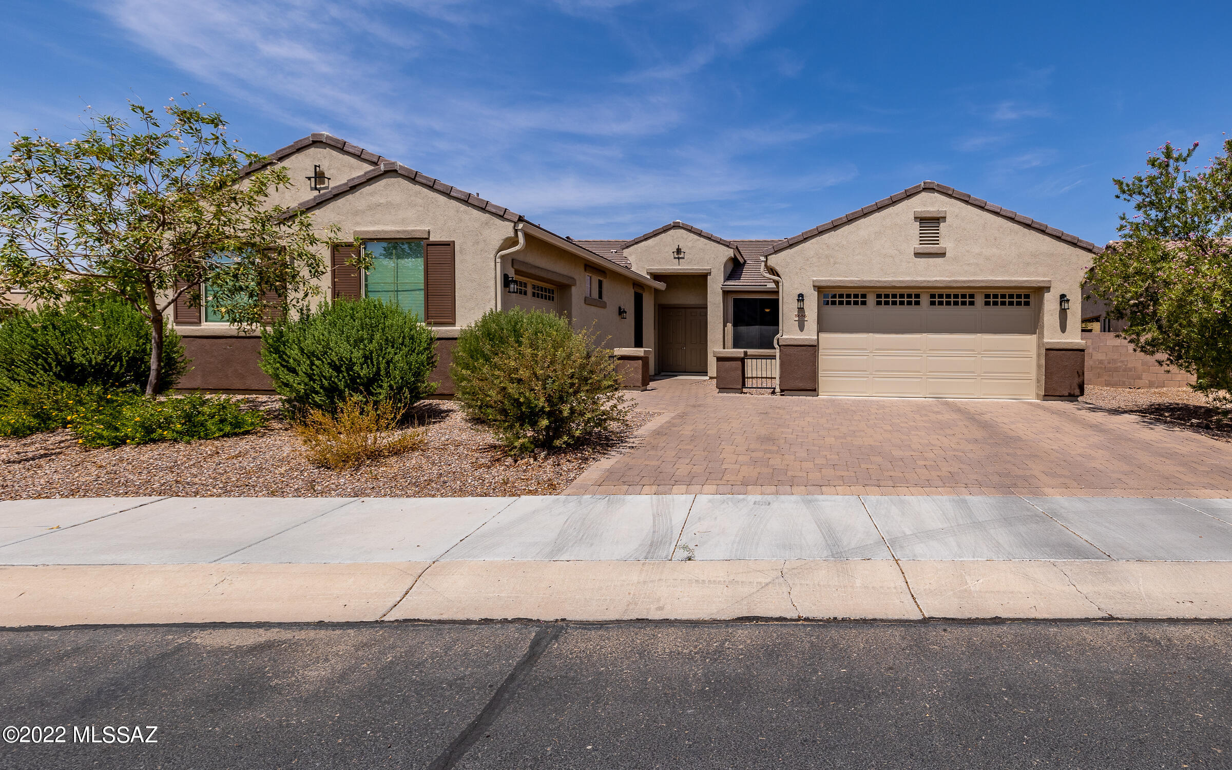 This stunning 4 bed/den/4bath home has all your heart's desires. You'll be in awe w/the 3-car garage, brick patio driveway, premier corner lot located across from the park, FULL exterior professional paint, tile roof, front courtyard w/double door entry, stunning foyer, two living areas, low profile window coverings & solar shades, fire suppression sys, water softener, tall ceilings throughout. The kitchen is gorgeous w/staggered espresso cabinets & crown molding, stunning backsplash, granite counters, island w/seating/electric/storage, stainless steel appliances, walk-in pantry, built-in desk, ceiling fans & large baseboards throughout, dining room has an elegant bay window. Owner's suite is huge w/double-door entry. Yard is professionally landscaped w/ turf, pavers & more...SEE VIDEO!!