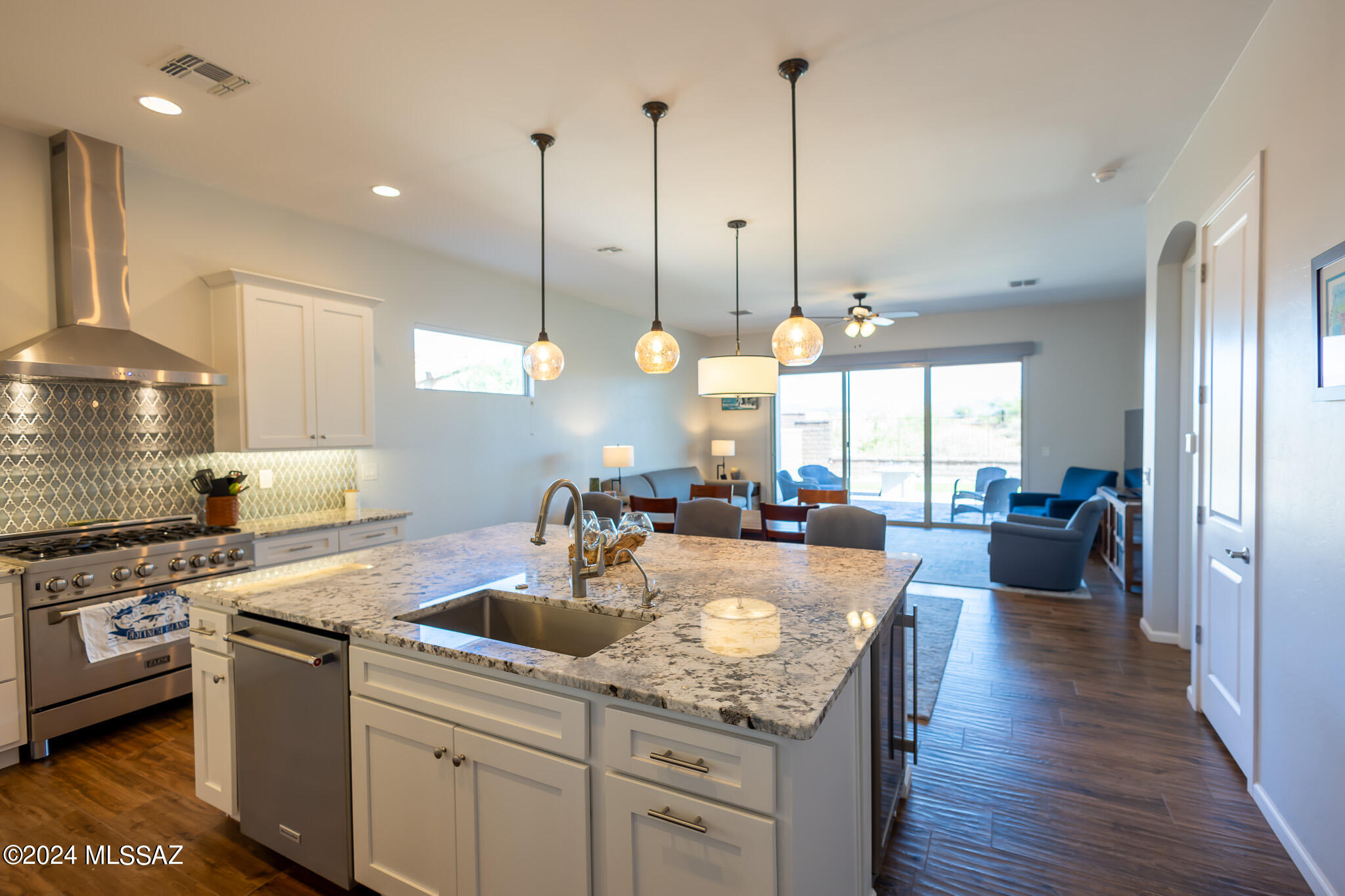 Tucked away in the exclusive gated Sonoran Desert Reserve, this stunning semi-custom home embodies luxury & comfort. With its inviting open floor plan & soaring ceilings, the space is bathed in natural light, creating a warm & welcoming atmosphere. The generously sized kitchen, adorned with elegant granite countertops, seamlessly connects to the great room, making it perfect for hosting gatherings. Boasting 3 bedrooms & 2 bathrooms, the home also includes a versatile bonus room ideal for a home office, library, or den. The backyard is an entertainer's paradise, featuring lush turf, a decorative gas fire feature, stylish pavers, an extended patio that provides ample shade & breathtaking mountain views. The meticulously landscaped front & backyards enhance the outdoor charm, The meticulously landscaped front & backyards enhance the outdoor charm, while the home's proximity to shopping, dining, & essential services adds to its appeal.