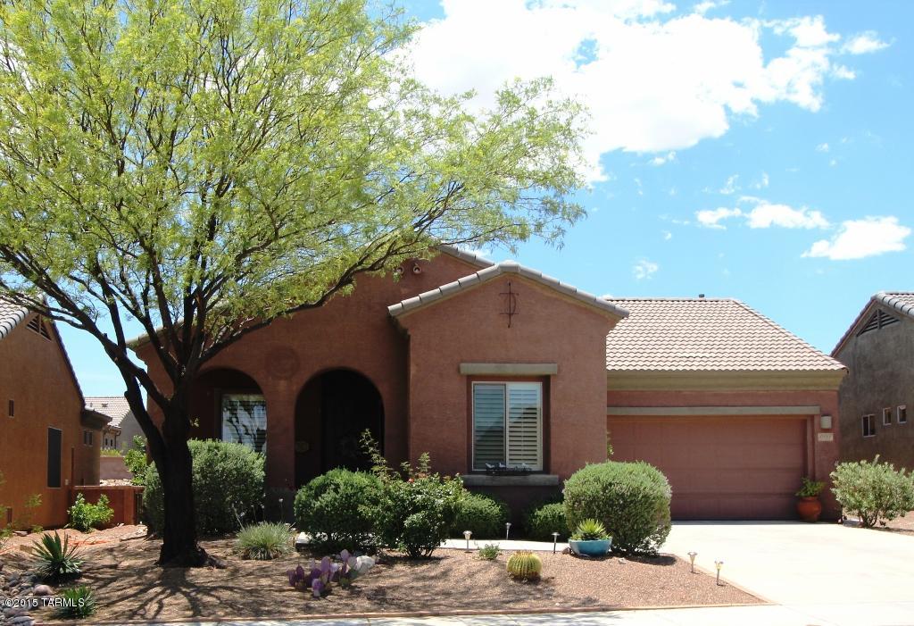 Bank Approved Short Sale Nestled in one of Green Valley's most prominent neighborhoods, You'll never want to leave this beautifully landscaped oasis with mountain views and an extended paver patio that can be accessed from both the master suite and the living room!  This two bedroom home has a beautiful kitchen with a decorative tile backsplash, solid surface counters, maple cabinetry,  tile flooring, a pantry and a pass-through opening to the dining area.  Upgraded light fixtures and fans throughout along with wood blinds and a fireplace with tile accents will WOW you!  All of this is located in the 55+ gated community of Canoa Ranch Subdivision, with great community pool and rec. center. Close to I-19, golf course and much more!