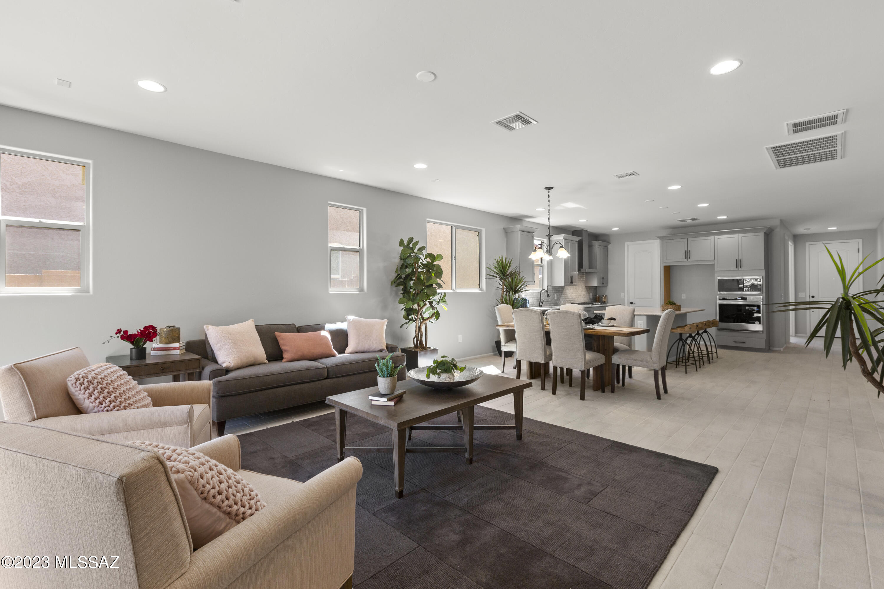 Rosewood plan Western Farmhouse elevation includes 3 Bedrooms, 2 full baths and a powder room. Enclosed Flex room & 2-car garage