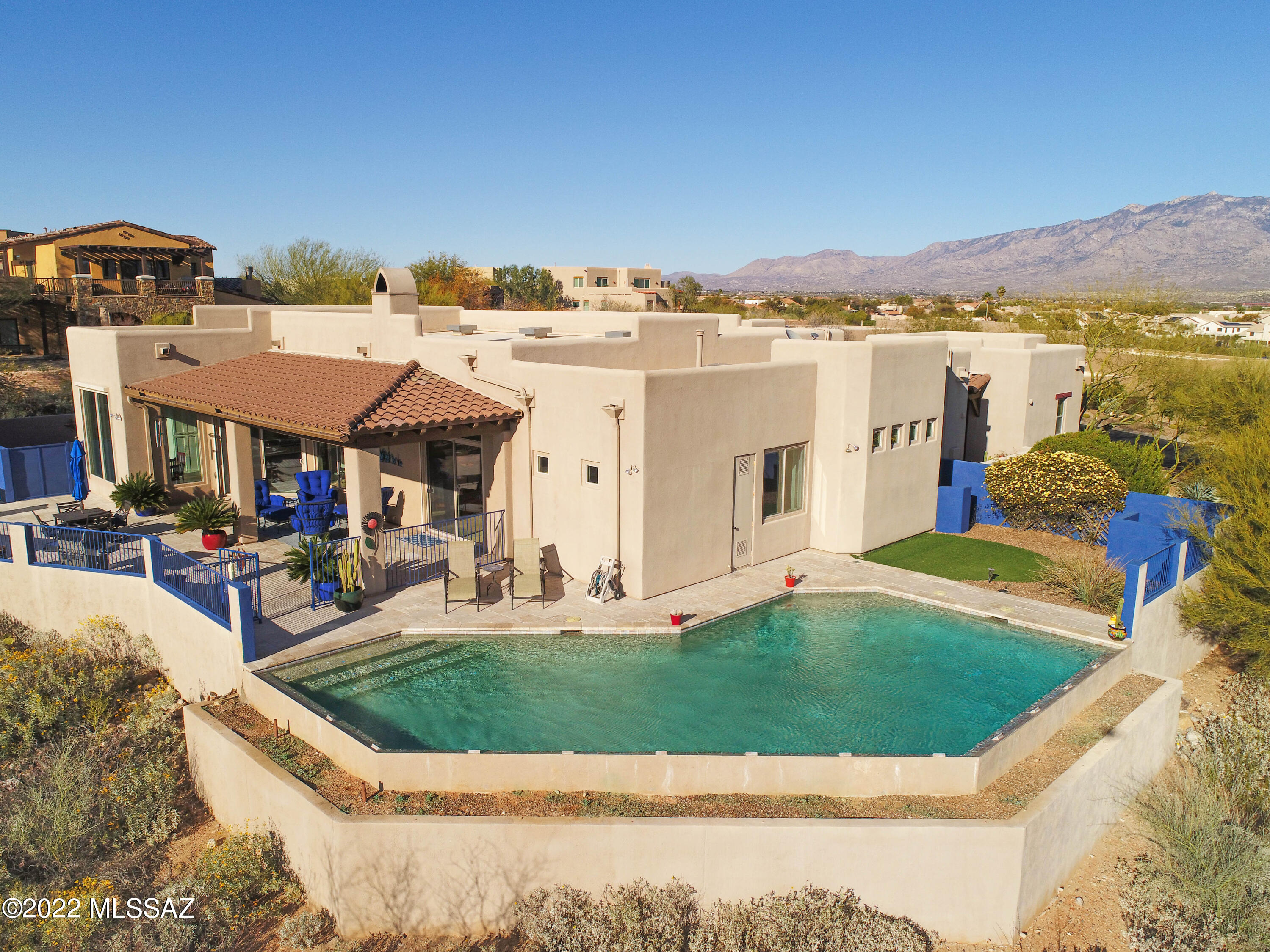 Artfully elegant, this magnificent desert retreat in a gated community has 4 bedrooms with an open floor plan and includes a 297 SF detached 1 bedroom guest casita. Features include priceless Catalina Mountain views, private entry courtyard, attached oversized 3 car garage plus separate expanded 2 car garage/workshop. You will happily spend hours in the gourmet kitchen with high-end stainless appliances, large butler pantry and formal dining area. The luxurious master suite with den has dual walk-in closets and a huge walk in shower with dual controls and oversized whirlpool tub. The rear patio area is a private oasis where you will relax and enjoy a sitting area with fire pit and swimming pool all with Pusch Ridge and City Views.