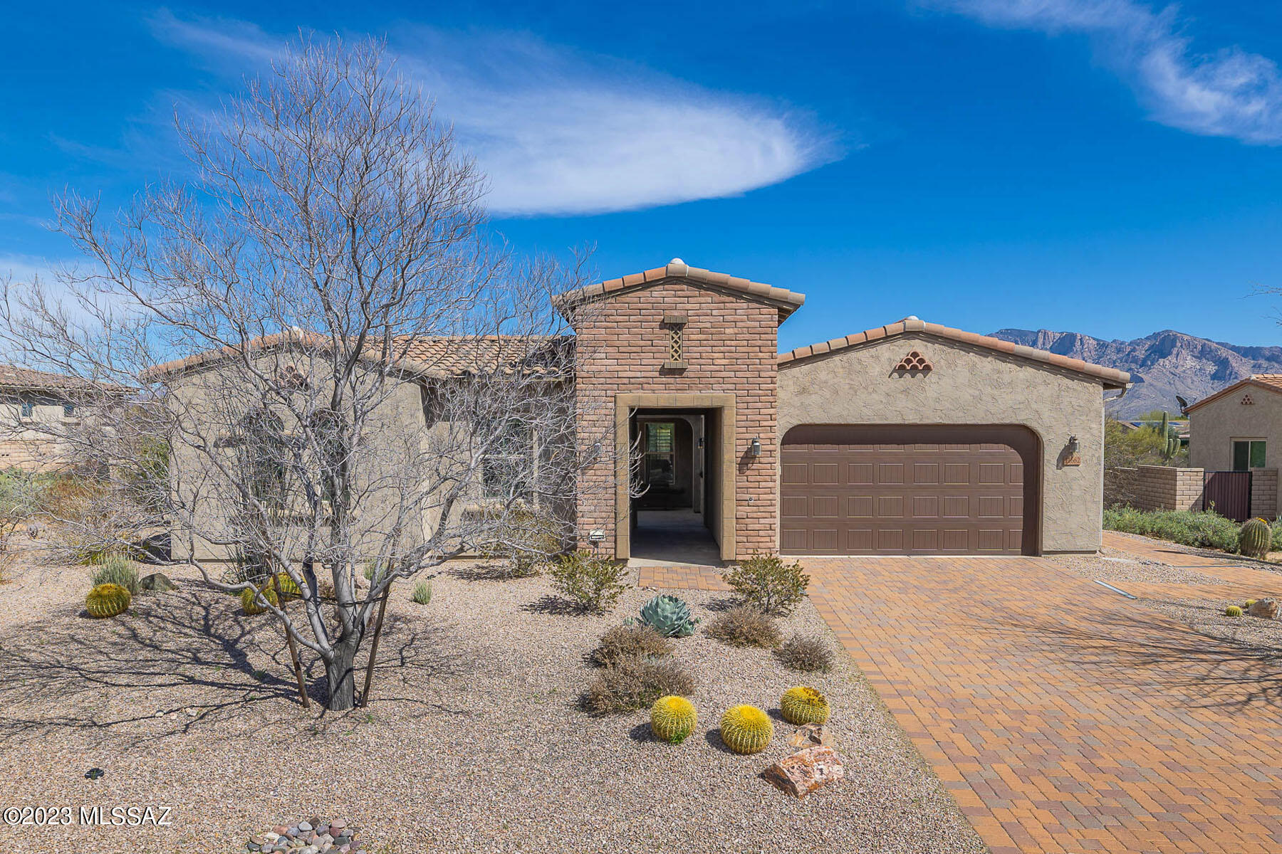 Exquisite 5BD/3BA +Den (2,974 sq ft) Cholla model on nearly a half acre cul-de-sac lot in gated Rancho Del Cobre boasts East facing magnificent Catalina views. Brick paver drive and stone facade entry flows to a courtyard. Beyond lies an open concept plan with living & dining areas plus gourmet island kitchen, granite counters, stainless appliances (double oven/gas cooktop) plus walk-in pantry. Private Owner's suite w/patio access hosts dual vanities, large garden tub, tiled shower plus huge walk-in closet. Split bedroom plan with 2 additional baths, central open Den, plus 5th bedroom or office. Hardwood floors, plantation shutters, 3-car tandem garage & numerous extras. Fabulous yard with extended travertine patio pavers & decorative turf. Perfect for the most discerning buyer!
