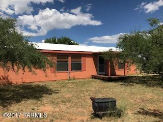Beautiful property with lots of room for animals, toys, gardens or whatever you wish!  Great room plan with large kitchen, 3 bedrooms, 2 baths and a large laundry room.  Several storage buildings and a pole barn with plenty of room for your car and your equipment.  Private well, mature trees, perimeter smooth wire fence and large fenced backyard for your dogs.  You will love the serenity of this property and if you want privacy and convenience to I-10 this is it!!