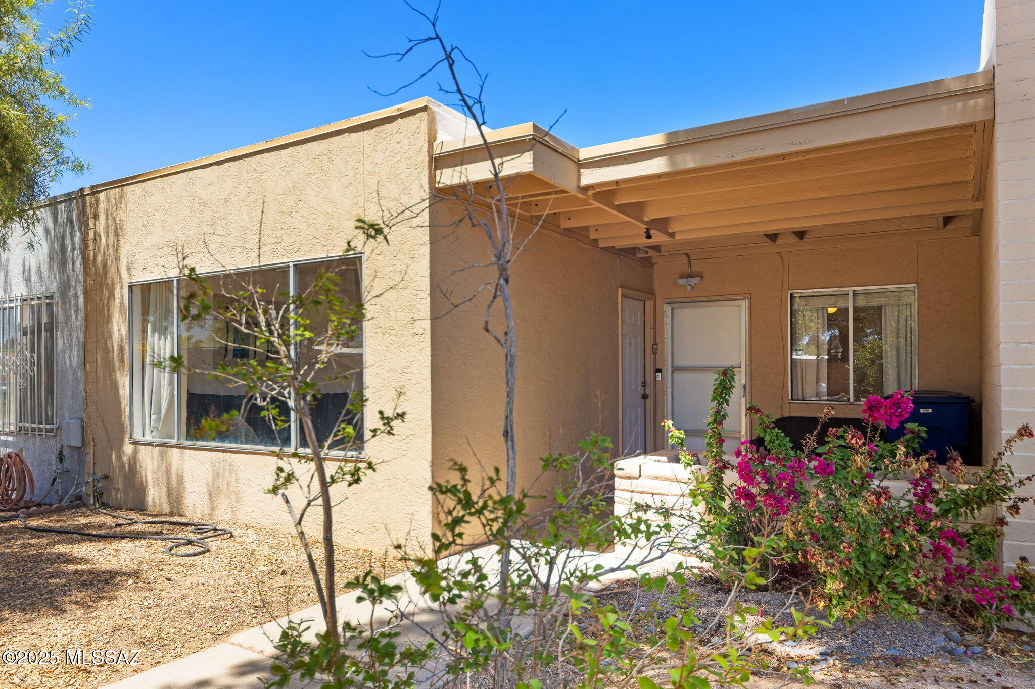Say hello to your new home in mid-town Tucson! This sweet and stylish townhouse is move-in ready and full of charm. You'll love the open layout with fresh paint, skylights that brighten every corner, and a cozy living room with a big picture window. The dining area is perfect for dinner parties and the updated kitchen shines with classic white cabinets, granite counters, & stainless Whirlpool appliances. With 3 spacious bedrooms, all with easy-care plank tile flooring, there's room for everyone. The primary suite features its own private bath with a white tiled shower, and the guest bath showcases cheerful original 1970s yellow tile that adds character and retro flair. Enjoy the bonus of a Sunroom that overlooks a low-maintenance backyard with turf, ideal for pets, gardening or relaxing! Roof re-coated December 2024 with two-year warranty. Water heater recently replaced. Rentals allowed in the community. Priced to sell!
