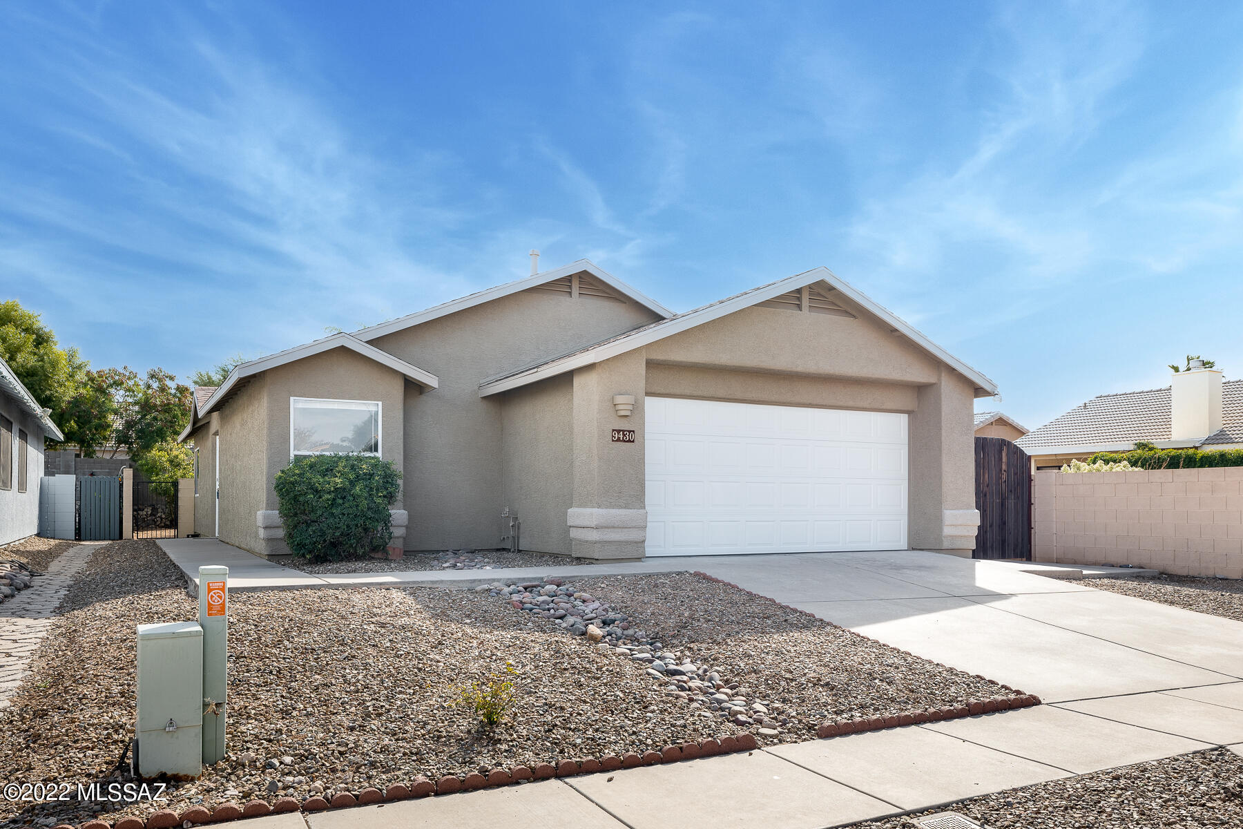 It's Perfect! Charming home with two bedrooms two baths and an office in popular Rita Ranch. The kitchen features granite counter tops and all new stainless steel appliances.  New carpets, beautiful tile and garage floor coat. Super easy care front and back yards that are just waiting for that personal touch.  Side yard has a concrete slab, great for extra parking.  Located in the highly sought after Vail School District, close to park,, walking paths, shopping, schools and easy access to I-10. NO HOA HERE!!  Roof replaced in 2022. Make this house your home!