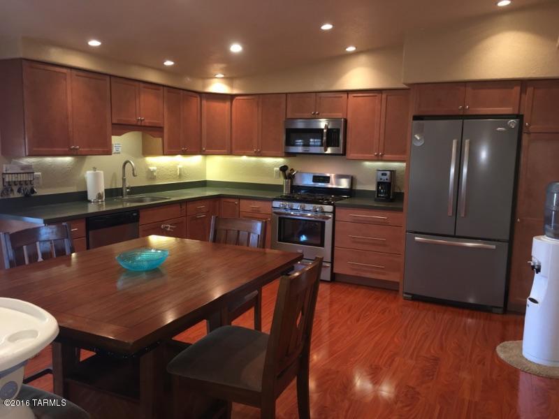 What a gem. Beauifully remodeled home with curb appeal on a corner lot. Exposed brick fireplace. Interior walls have all been dry walled, large bedrooms and no popcorn cielings. Recest lighting and wired fans through out, wood floors, new kitchen with pantry and storage, corian countertops, stainless steel appliances. New windows and doors.Newer AC and Electrial within 5 years and new duct work. French doors off Kitchen and master to the backyard. Big laundry room inside. Nice backyard landscaping with irrigation. Mountain view. Access to backyard with metal slide gate. Huge entertainers porch(permitted). Detached garage(permitted), apoxy floor 100amp and 220 with evap cooling. This house has it all and is beautiful.