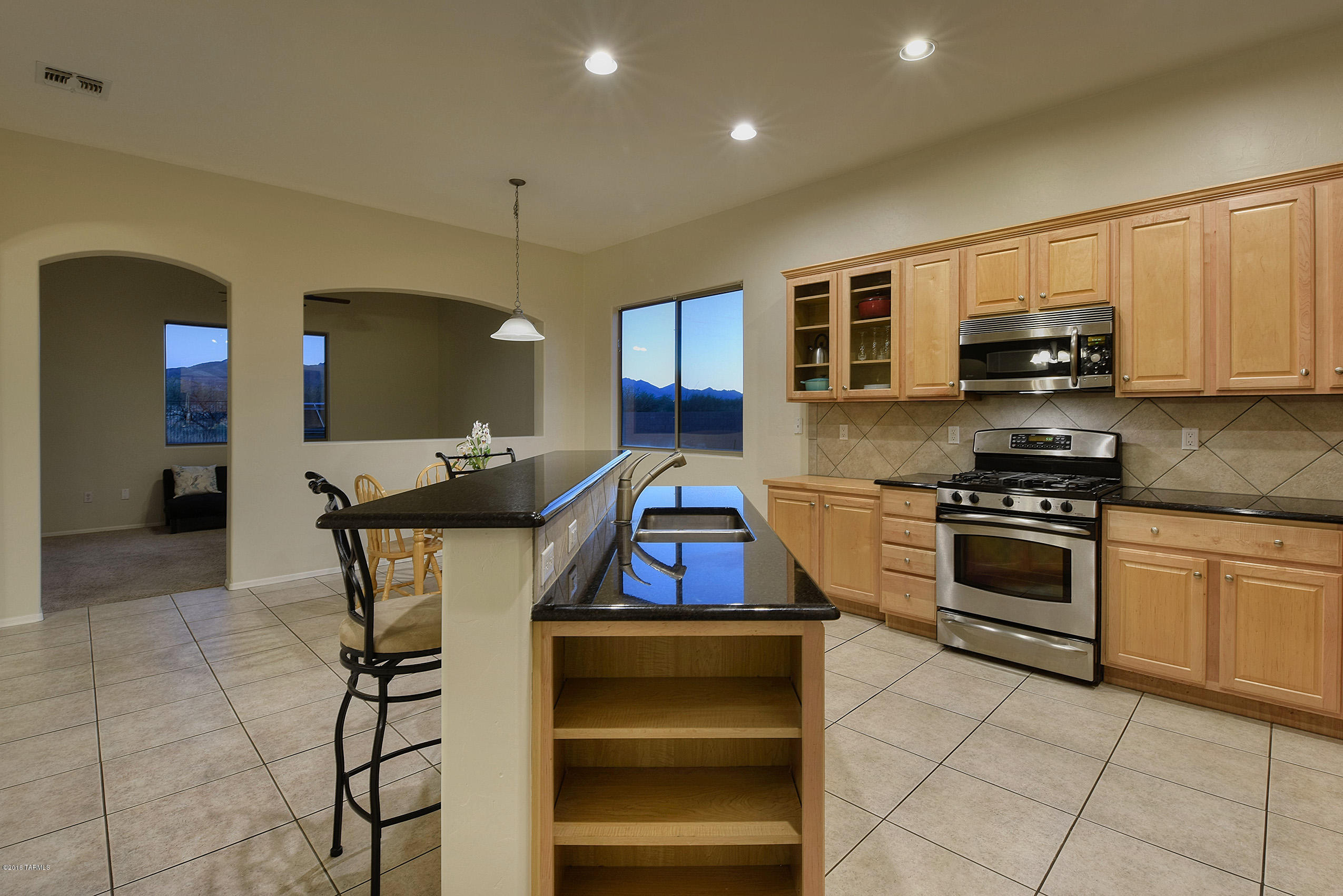 BREATHTAKING Sunsets & Magnificent Mountain Views from this 4bdrm/2ba contemporary family home in the desirable Vail School District. Situated on an unbelievable .35 acre lot & promising plenty of privacy, this remarkable property won’t last long! Kitchen features Granite countertops, tile flooring, stainless steel appliances, glass panel & light oak kitchen cabinets, under mount stainless steel sink & recessed lighting.  Spacious den & living area boast stunning views of the Santa Rita Mountains. Master bedroom features glass panel door that leads to the expansive open back yard & an ensuite complete w/soaking tub, stand alone shower, & expansive walk-in closet. Solar panels save an average of $1000/yr on electricity costs. 30 amp, Level 2 car charger Conveys. Come see this Home today!