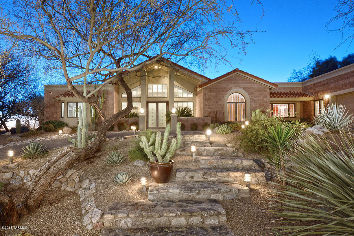 Wonderful custom home with high cathedral ceilings in the great room with stone fireplace.  New updated contemporary kitchen with stainless steel and granite, new cabinets, double oven, warming drawer, subzero freezer, refrigerator, and Viking gas range.  Home theater with projector and drop down screen and fireplace. Luxurious master suite, guest quarters with door out to patio, plus formal living and dining rooms, 2 more bedrooms, fabulous backyard with deep covered patio, pool, spa and waterfall.
