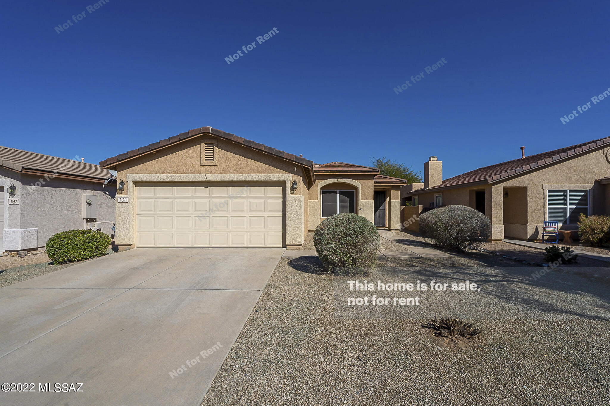This Tucson one-story home offers a two-car garage.