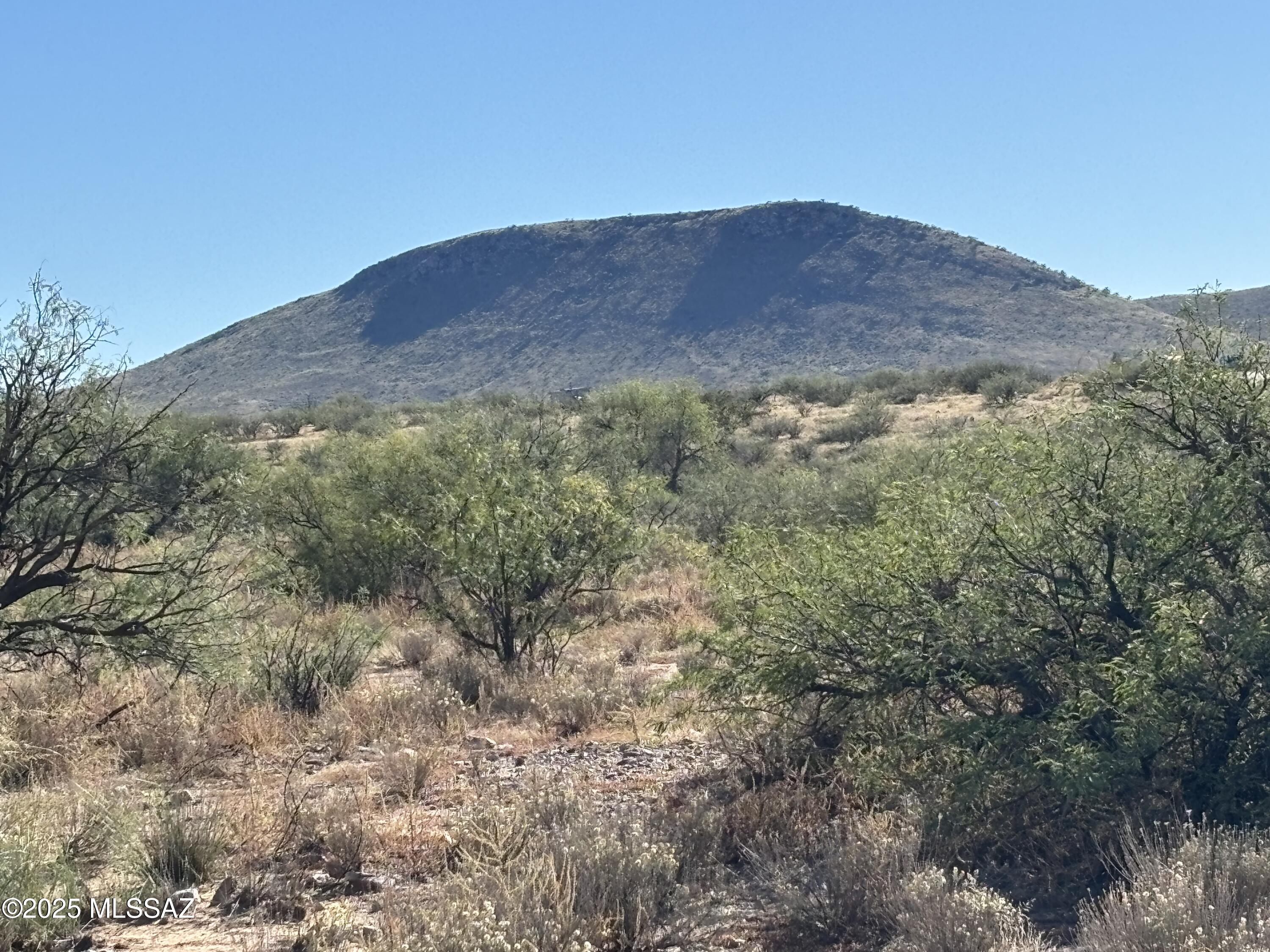 MOTIVATED SELLER!! BRING ALL OFFERS!! Off-grid 40-acre parcel with panoramic views: Chiricahua Mountains to the east, Dragoon Mtns to the West and Swiss Helms Mtns to the South. Registered Solar-powered well provides sustainable water. (septic needed). Full disclosure, solar panel & battery for well burned in a fire and will need to be replaced. No HOA. Enjoy privacy, adventure and Arizona wilderness. Nearby Pearce/Sunizona offers groceries, dining and schools - perfect for your dream retreat.