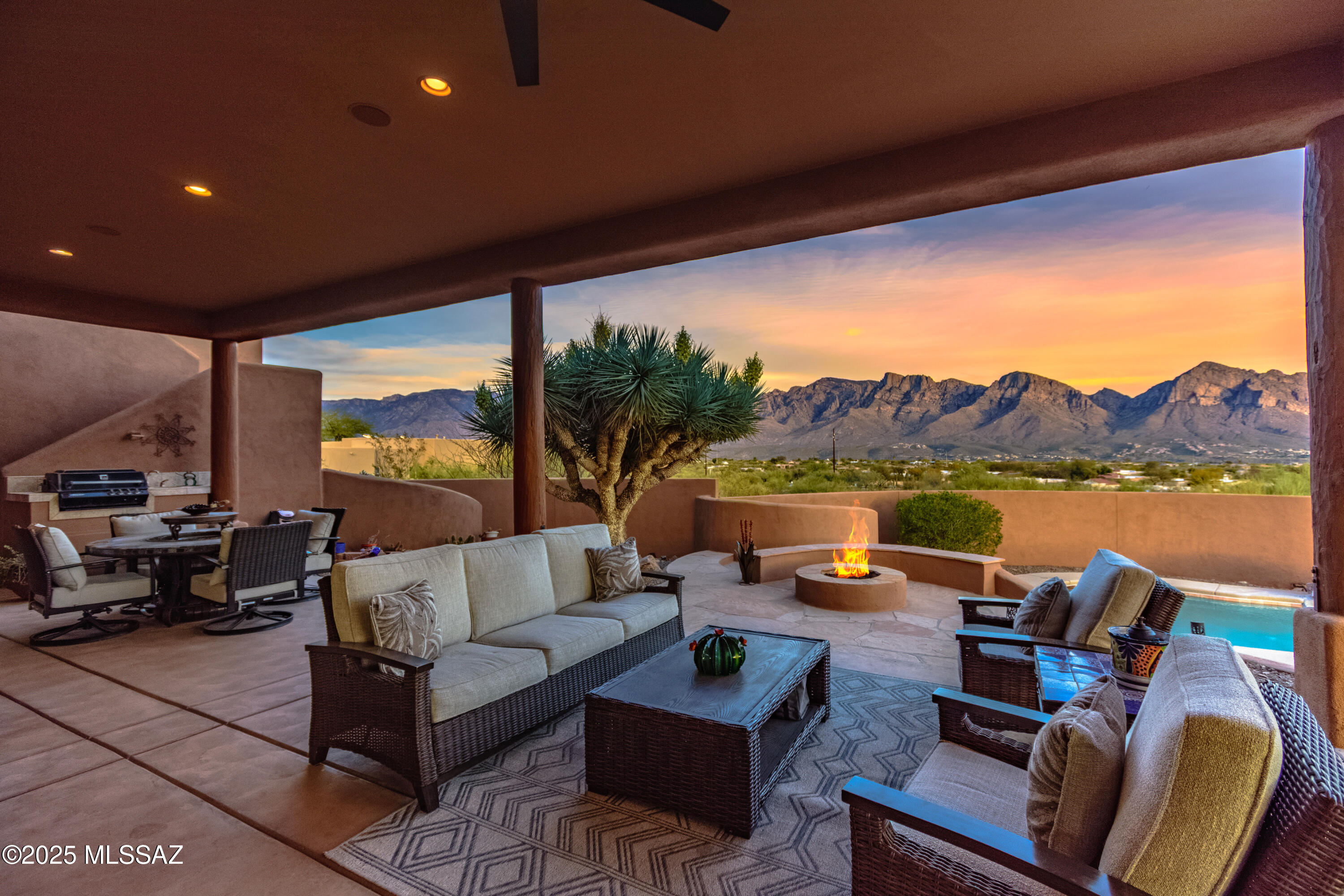 Exceptional custom ridge-top residence in prestigious Coyote Ridge community. The home spans 2,923 sf & is complimented by detached 314 sf Guest House. Offers breathtaking Pusch Ridge Mtn views & gorgeous sunrises/sunsets. Enjoy indoor-outdoor living w/ a wrap-around covered patio & multi entertainment areas, roof-top deck, firepit & pebble-tec pool. 1 story - no steps. SOLAR! Fully prepaid 20 yr lease thru 2034. Features: Expansive chef's kitchen with a sweeping counter bar & island that can seat the whole family. Spa-like primary suite. Office/bonus room (4th bdrm). Open floor plan & high ceilings. Original owner pride. Surrounded by parks, golfing, hiking, shopping & world class amenities. Adjacent to bicycle/walking path. Enjoy the best of Tucson living!