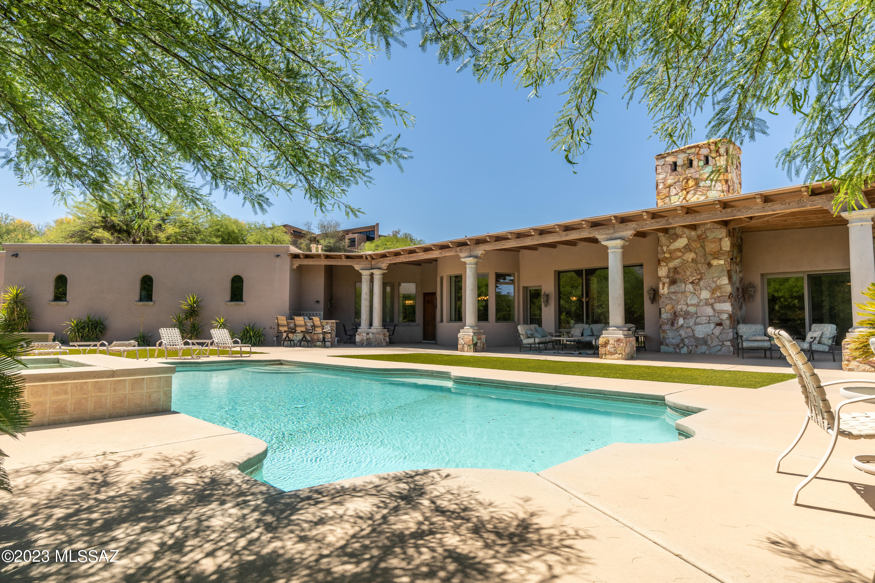 LA PALOMA! Highly Sought After, Guard Gated Community of La Paloma Estates. A Truly Remarkable Tuscan Designed Custom Home by Renowned Architect Kevin Howard. The Home is Well Oriented to Take Advantage of the Spectacular Catalina Mountain Views and Colorful Sunsets.  Inviting Entrance through the Grand Foyer Reveals Timeless Elegance. Magnificent Interior Features: Exquisite Great Room with High Ceilings, Porcelain Tile Floors, Schist Rock Fireplaces, Wood Beam Ceilings, Lovely Arches and Windows, Classic Tuscan Concrete Columns and Sophisticated Finishes. Owner's Retreat with a Discrete Patio, Sensational Shower, Soaking Tub and Roomy Walk-in Closet. Chefs Kitchen Boasts an Expansive Island for Gathering or Prepping. Stainless Steel Appliances. Generously Proportioned Rooms, Paired CONT with a Thoughtful Floor Plan is Ideal for Entertaining and Casual Living. Stay Fit in Your Own Work Out Room. Lounge by the Sparking Pool that Serves as the Centerpiece of the Backyard. Lush Vegetation Creates a Serene Oasis. Fabulous Full Length Back Patio, Outdoor Kitchen, Fireplace and Fountain. Spacious Outdoor Living Environment Exemplifies Resort Style Living. Minutes from Fine Dining and Upscale Shopping at La Encantada, you are in the Heart of the Foothills Corridor with Art Galleries, Financial Services, Catalina Foothills District 16 Schools, Numerous Hiking Trails, and Climbing Spots. Homes in La Paloma Estates Are Not Available for Sale Often. DO NOT MISS THIS OPPORTUNITY. COME SEE THIS GEM TODAY!