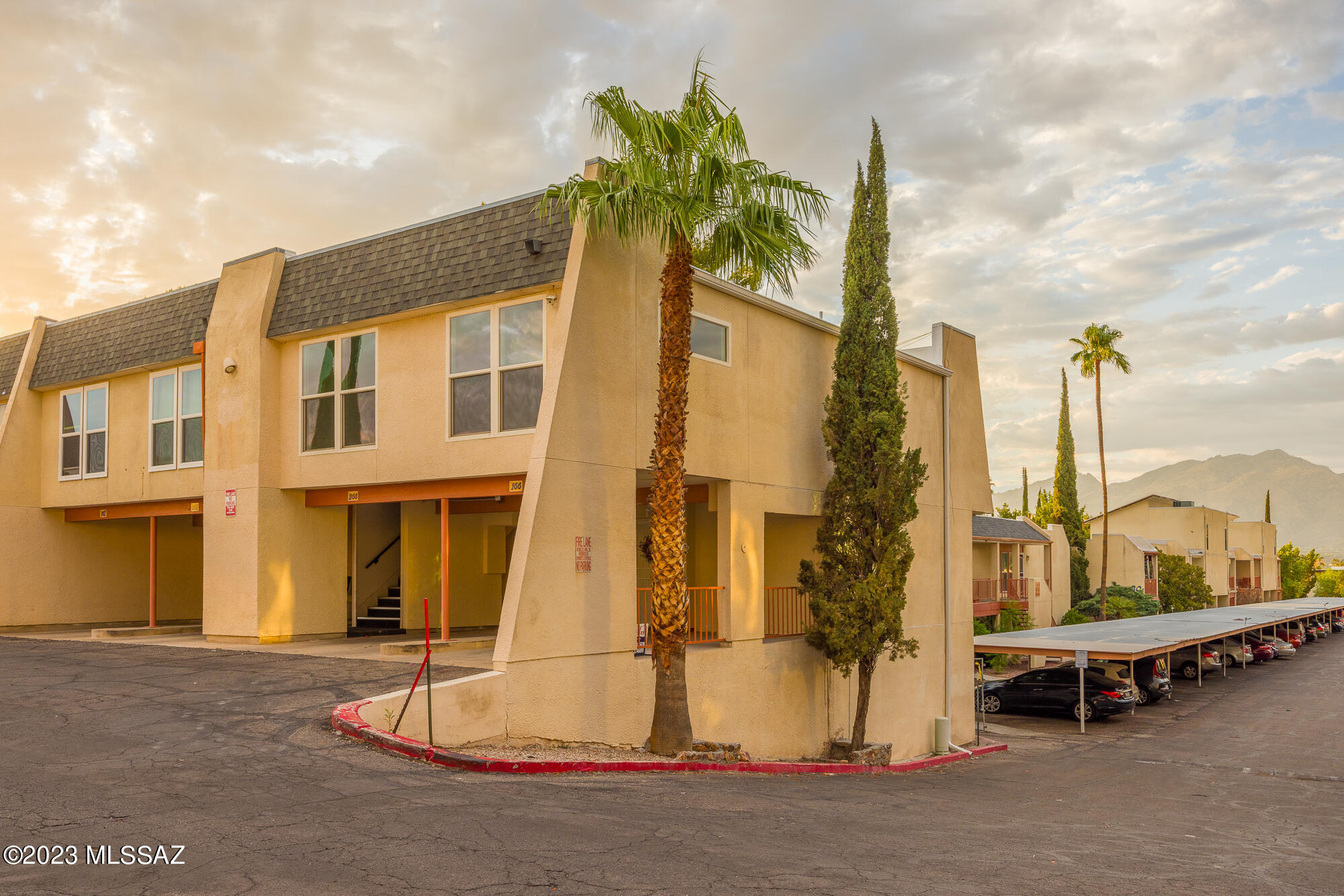 Completely renovated unit with upgrades throughout-All new walls, insulation, electrical, HVAC, lighting, bathrooms, Kitchen including stainless appliances/refrigerator, Carpet in main areas, LVP in kitchen, foyer, bathrooms.
North facing view of the gorgeous Catalina Mountains from the living room/balcony. Convenient parking in front of unit for entry into main living space, kitchen and half bath (no stairs to enter the unit). Stairs located inside go down to the Master suite w/ walk-in closet and full bath.  This floorplan features in-unit washer/dryer.  HOA includes water, sewer, trash pickup, 2 pools, exterior maintenance, and termite treatment. 
Carport prewired for an EV vehicle.
Additional carport spaces available for rent.