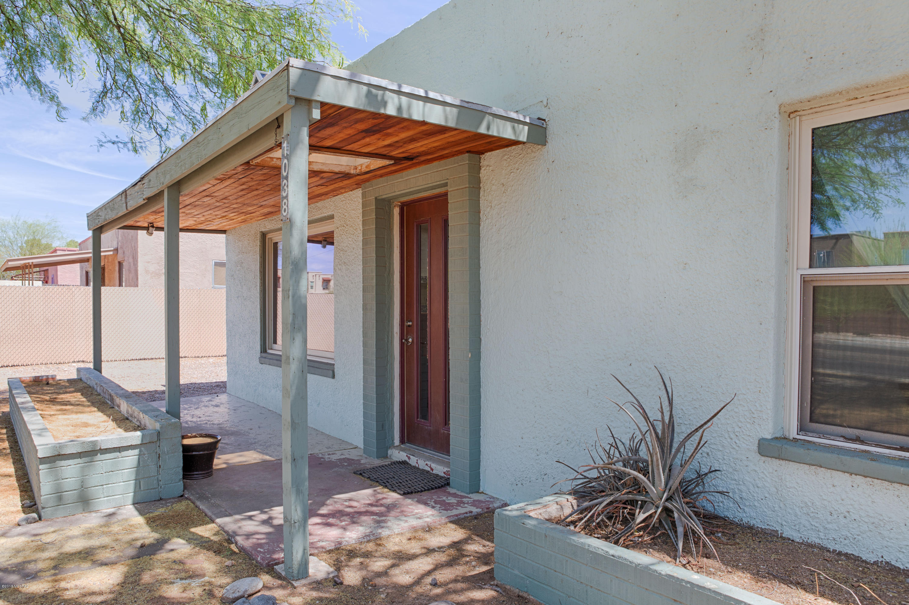 This charming historic home is the perfect place for those wishing to be near the University and Downtown area! Perfect for Students and Faculty at the University of Arizona. The home features off street parking and lovely backyard with mature trees that offer plenty of shade. Entering the home you will find the living room with terra cotta Spanish style flooring with triple pane windows. The dining area is open to the kitchen via a colonial style archway and the kitchen features a Gas stove and double sink in stainless steel, as well as a dishwasher and microwave. The bedrooms are both near the single bathroom and home boasts three skylights throughout that creates a cheerful and bright atmosphere. Arizona Room and laundry in the back. Easy walk to Mitchell Park. Come see today!